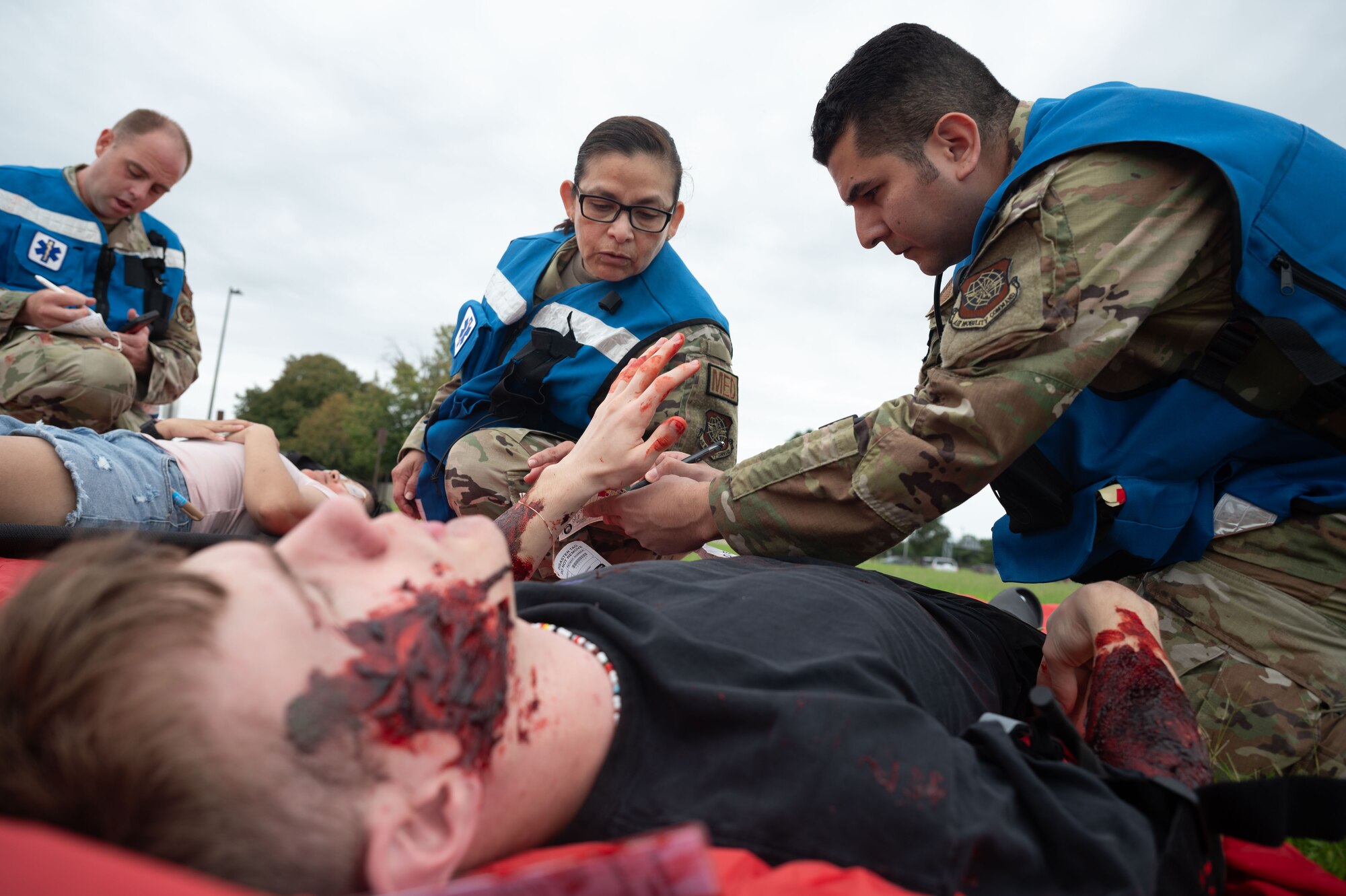 Team Dover Airmen check the vitals of a patient during the Ready Eagle II exercise at Dover Air Force Base, Delaware, Aug. 8, 2024. The exercise was used to test Medical Contingency Response Plan Readiness and the current response capabilities for mass casualty care. (U.S. Air Force photo by Senior Airman Dieondiere Jefferies)