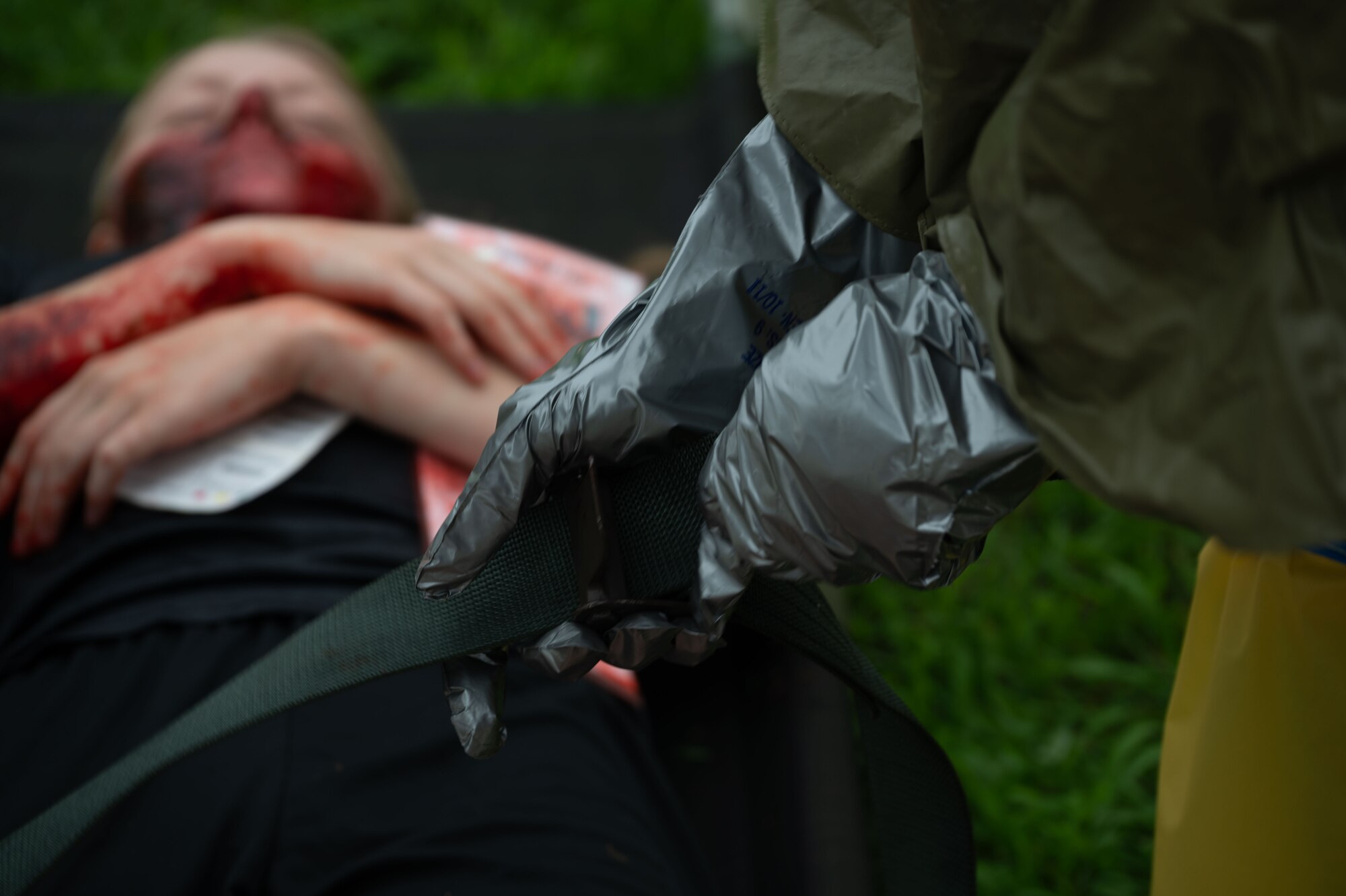 A Team Dover Airman secures the strap on a patient during the Ready Eagle II exercise at Dover Air Force Base, Delaware, Aug. 8, 2024. The exercise was used to test Medical Contingency Response Plan Readiness and the current response capabilities for mass casualty care. (U.S. Air Force photo by Senior Airman Dieondiere Jefferies)