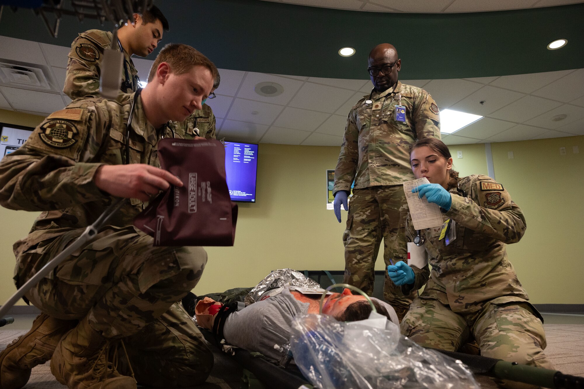 Team Dover Airmen administer life-saving care to a patient during the Ready Eagle II exercise at Dover Air Force Base, Delaware, Aug. 8, 2024. The exercise was used to test Medical Contingency Response Plan Readiness and the current response capabilities for mass casualty care. (U.S. Air Force photo by Senior Airman Dieondiere Jefferies)