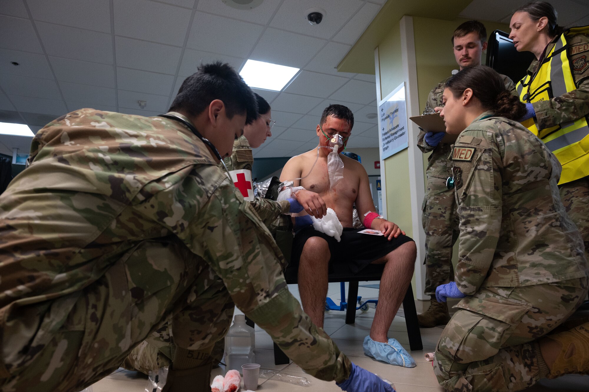 Team Dover Airmen administer oxygen to a patient during the Ready Eagle II exercise at Dover Air Force Base, Delaware, Aug. 8, 2024. The exercise was used to test Medical Contingency Response Plan Readiness and the current response capabilities for mass casualty care. (U.S. Air Force photo by Senior Airman Dieondiere Jefferies)