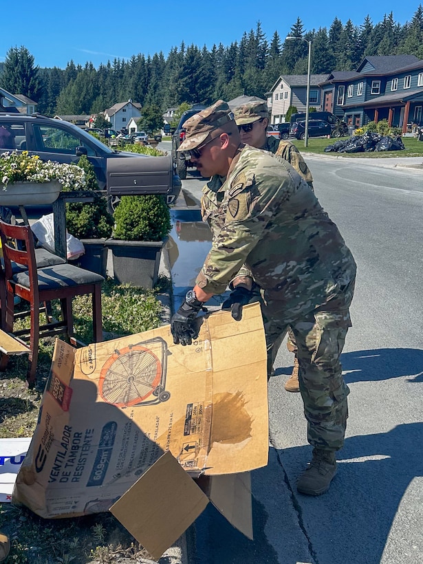 Alaska Army Guardsmen with Joint Task Force – Juneau partner with the Department of Transportation to assist Juneau residents with recovery and cleanup efforts Aug. 8, 2024, following recent flooding after the Mendenhall Glacier’s Suicide Basin released. The State Emergency Operations Center requested 40 members of the Alaska Organized Milita to assist with flood recovery efforts. Seven Guardsmen from Juneau began work Aug. 7, and an additional 33 Air and Army Guard volunteers from the Fairbanks and Anchorage will fly to Juneau in the coming days as part of JTF-J.