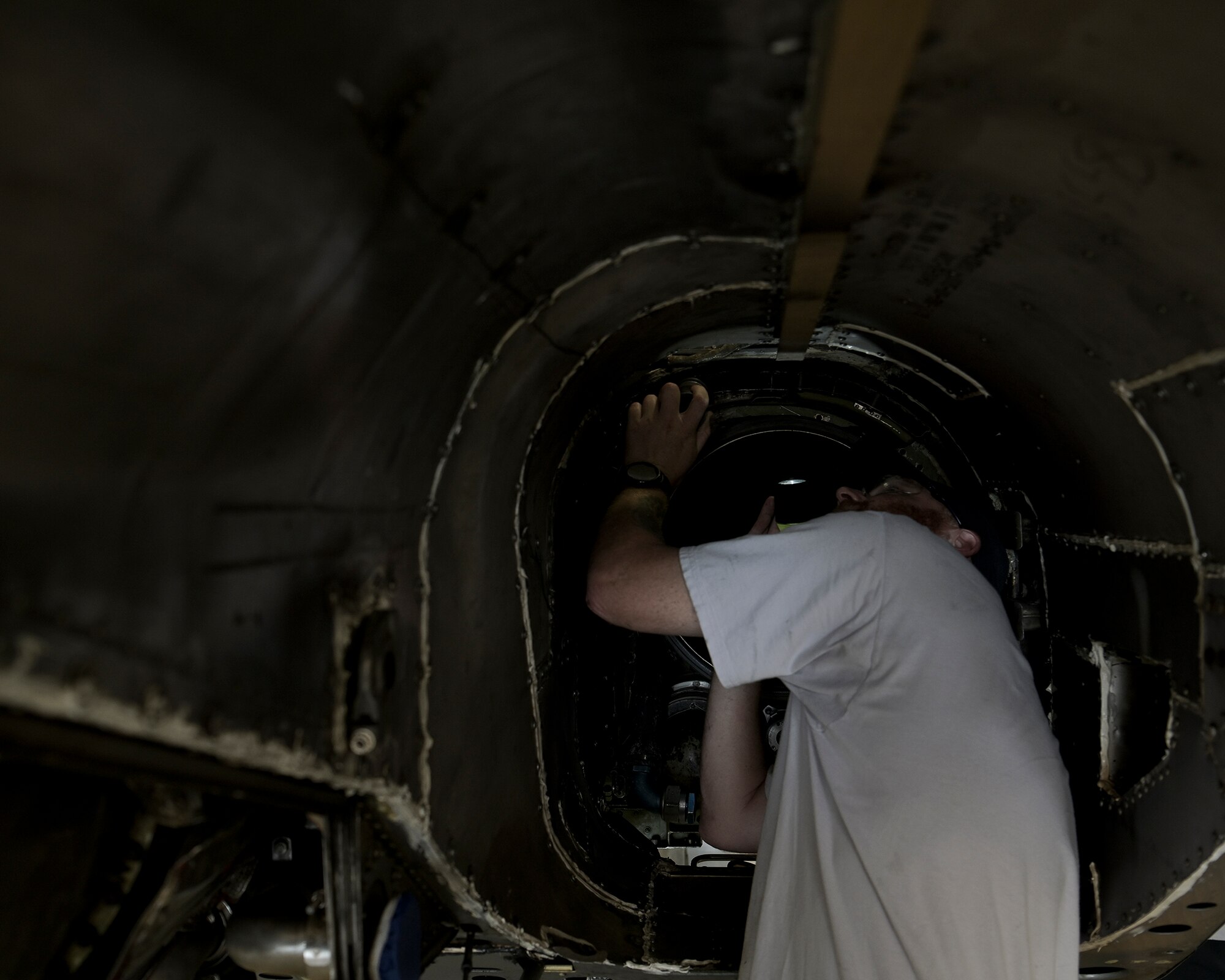 Aircraft maintenance personnel perform maintenance.