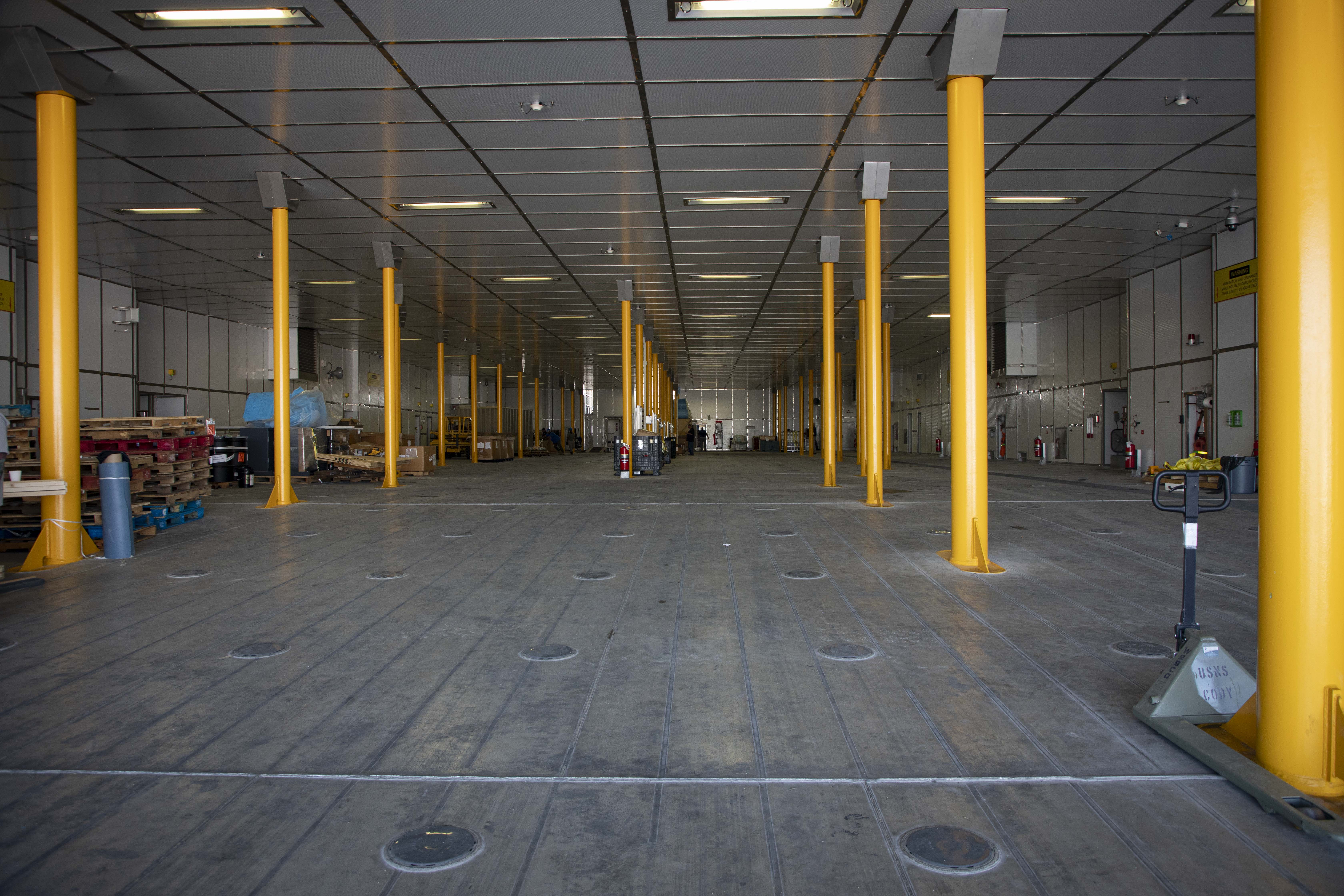 240715-N-KC192-1019 JOINT EXPEDITIONARY BASE LITTLE CREEK-FORT STORY, Va. (July 15, 2024) The main deck of the expeditionary fast transport ship USNS Cody (T-EPF 14) before being filled with ten 20-foot equivalent units (TEUs), July 15, 2024. The U.S. Navy is embarking the first Expeditionary Medical Unit (EMU), a cutting-edge medical support system with support personnel from EMU-1, designed to provide Role 2 level healthcare services both afloat and ashore.  (U.S. Navy photo by Mass Communication Specialist 2nd Class Levi Decker)