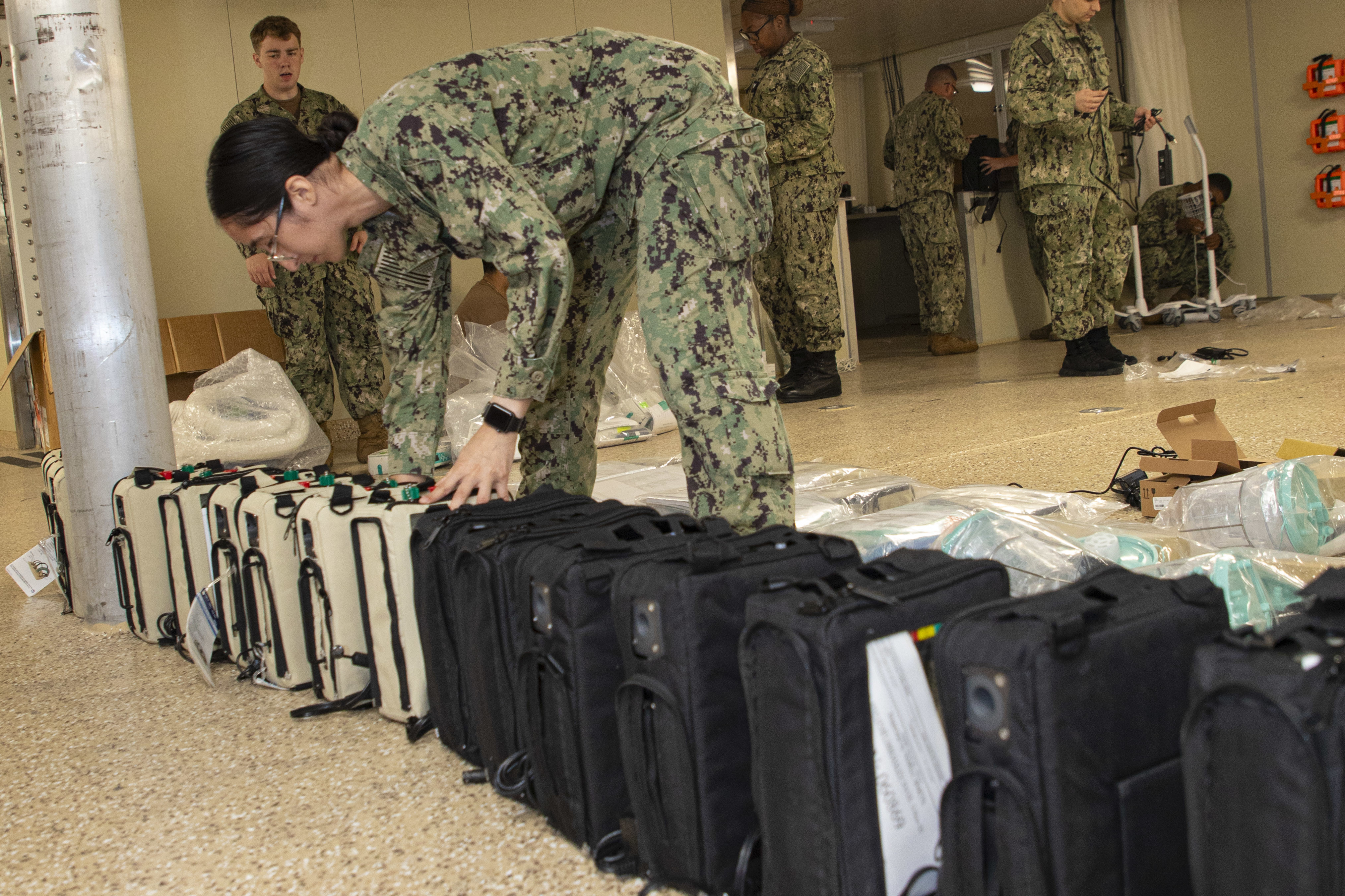 240723-N-KC192-1027 JOINT EXPEDITIONARY BASE LITTLE CREEK-FORT STORY, Va. (July 23, 2024) Hospital Corpsman 3rd Class Gennessy Palma, assigned to Navy Medicine Readiness and Training Command (NMRTC) Jacksonville, inventories equipment onboard the transport ship USNS Cody (T-EPF 14), July 23, 2024. The U.S. Navy is embarking the first Expeditionary Medical Unit (EMU), a cutting-edge medical support system with support personnel from EMU-1, designed to provide Role 2 level healthcare services both afloat and ashore.  (U.S. Navy photo by Mass Communication Specialist 2nd Class Levi Decker)