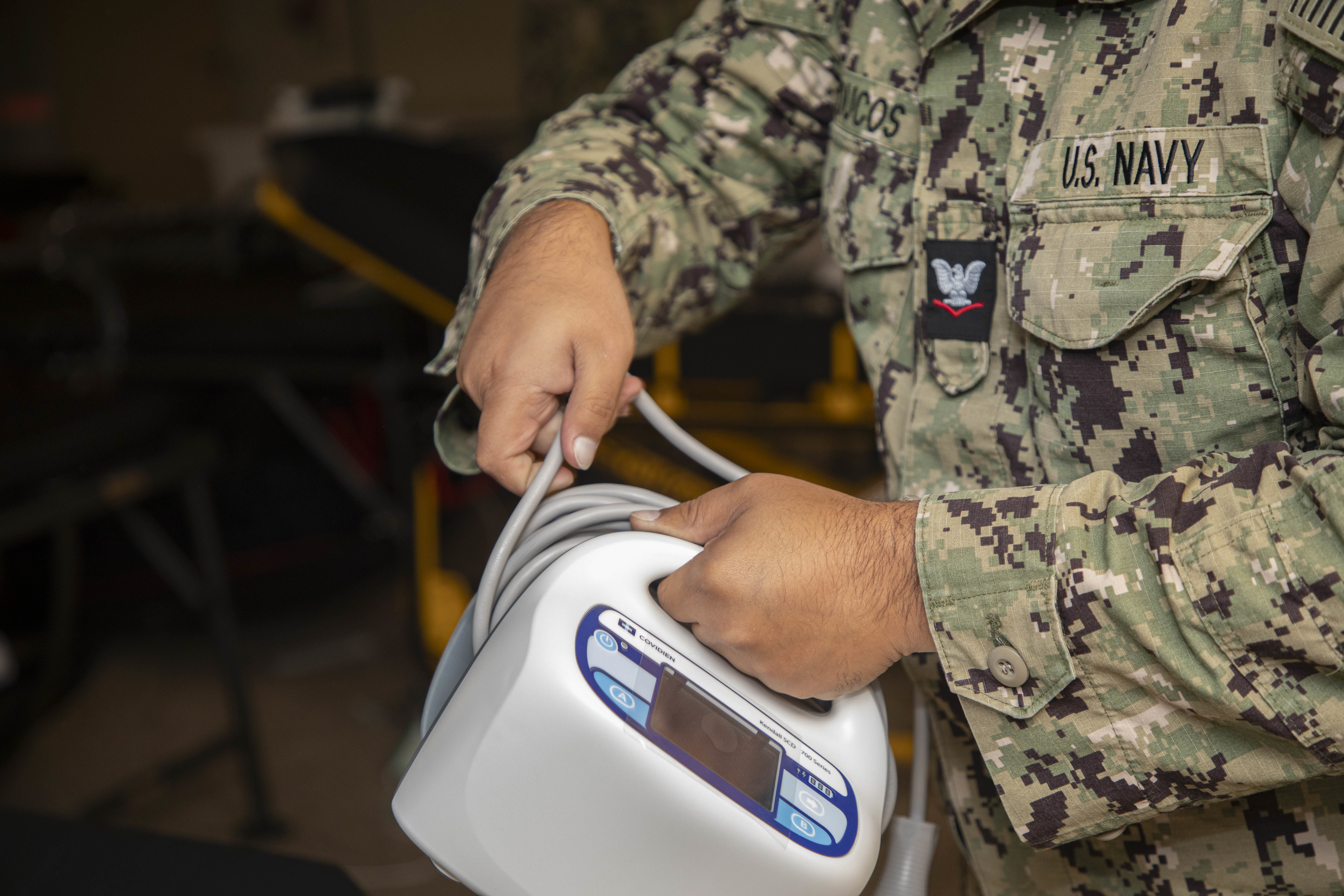 240722-N-KC192-1047 JOINT EXPEDITIONARY BASE LITTLE CREEK-FORT STORY, Va. (July 22, 2024) Hospital Corpsman 3rd Class Ronald Ducos, assigned to Navy Medicine Readiness and Training Command (NMRTC) Jacksonville, disassembles equipment for pack up onboard the transport ship USNS Cody (T-EPF 14), July 22, 2024. The U.S. Navy is embarking the first Expeditionary Medical Unit (EMU), a cutting-edge medical support system with support personnel from EMU-1, designed to provide Role 2 level healthcare services both afloat and ashore.  (U.S. Navy photo by Mass Communication Specialist 2nd Class Levi Decker)