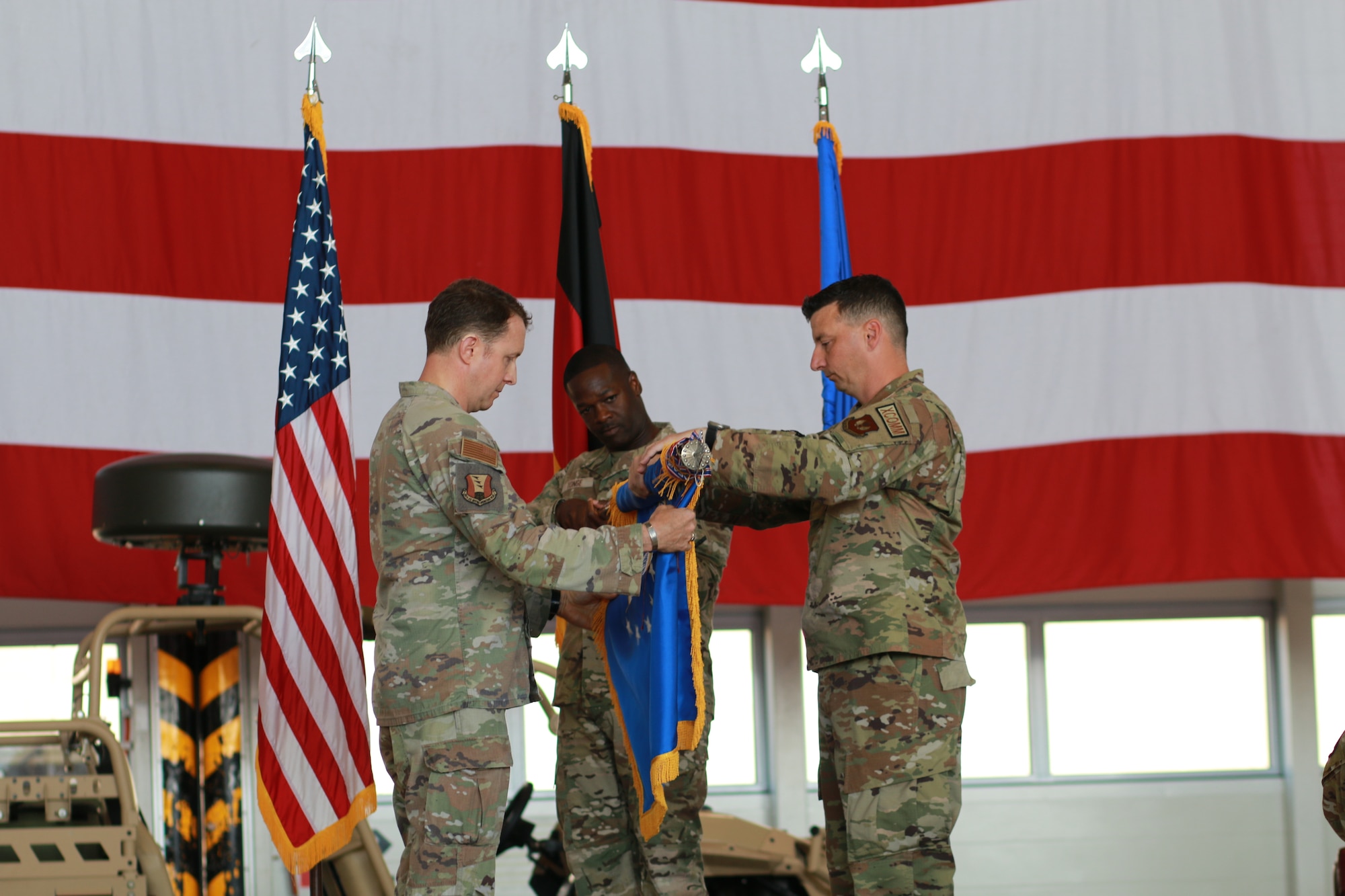 Members participate in a change is designation ceremony.