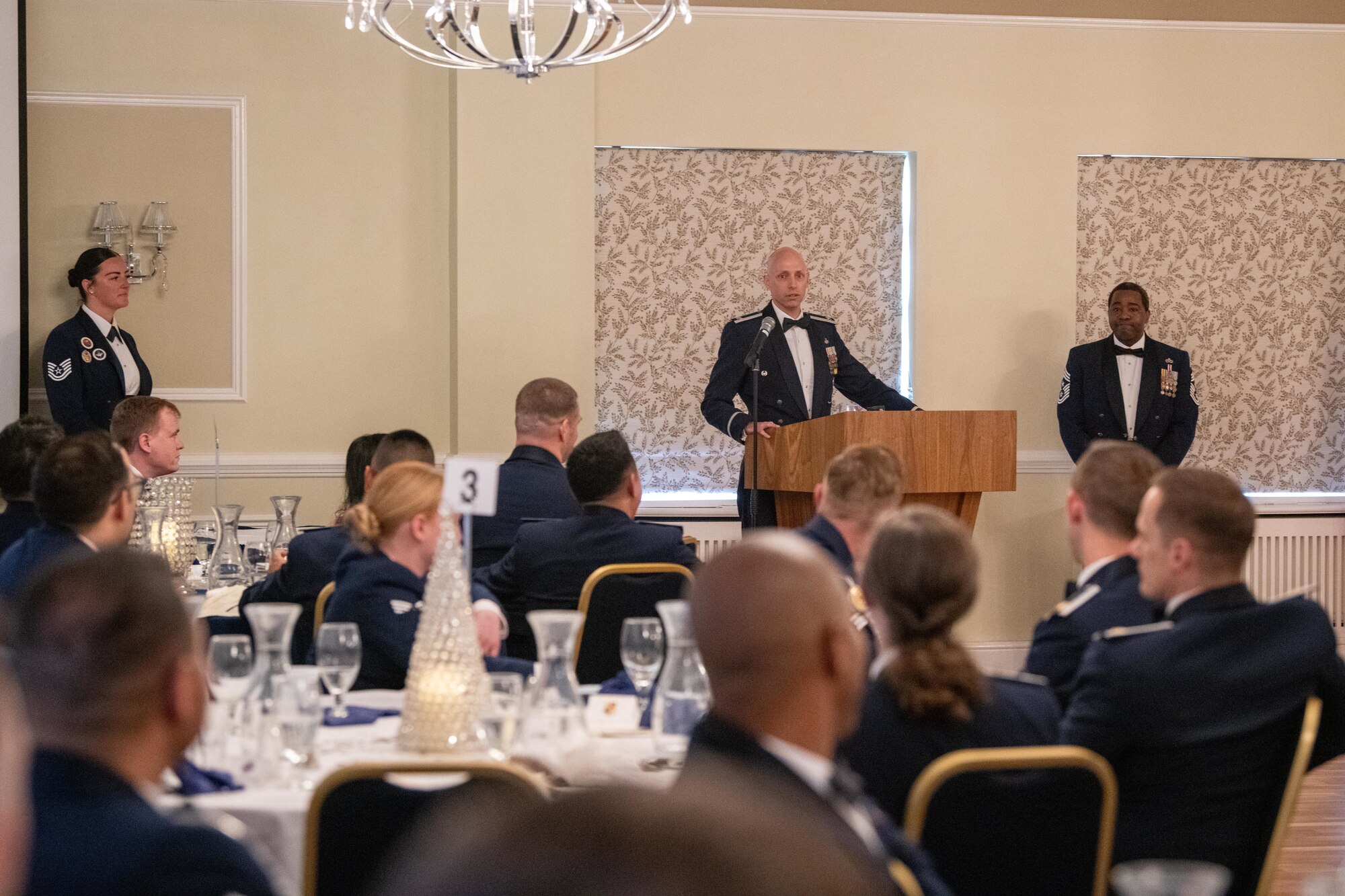 Airman gives remarks during an ALS graduation ceremony