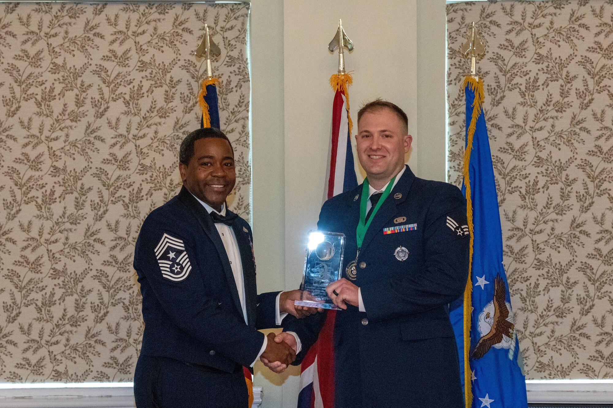 Airman receives the academic achievement award during an Airman Leadership School graduation ceremony