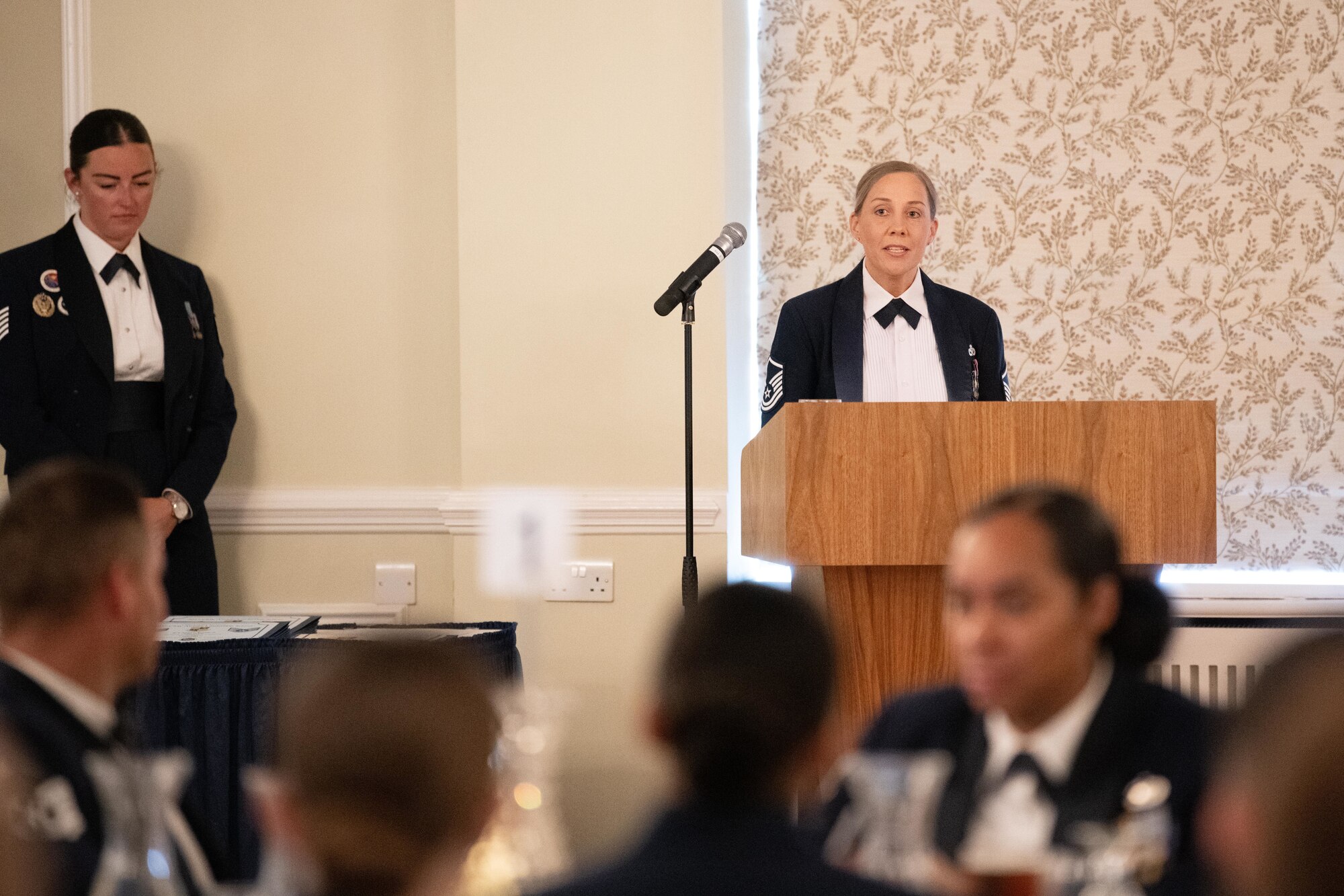 Airman gives remarks during an ALS graduation ceremony