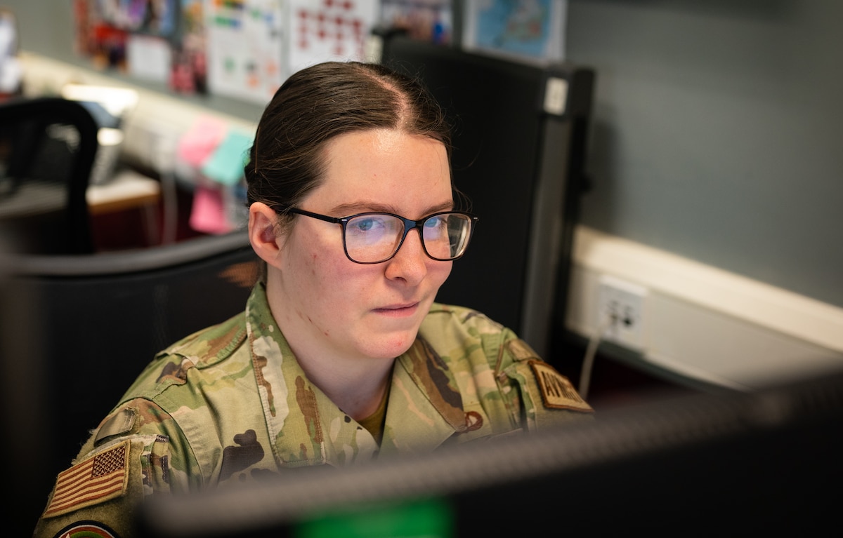 U.S. Air Force member sets up a schedule on a computer program.