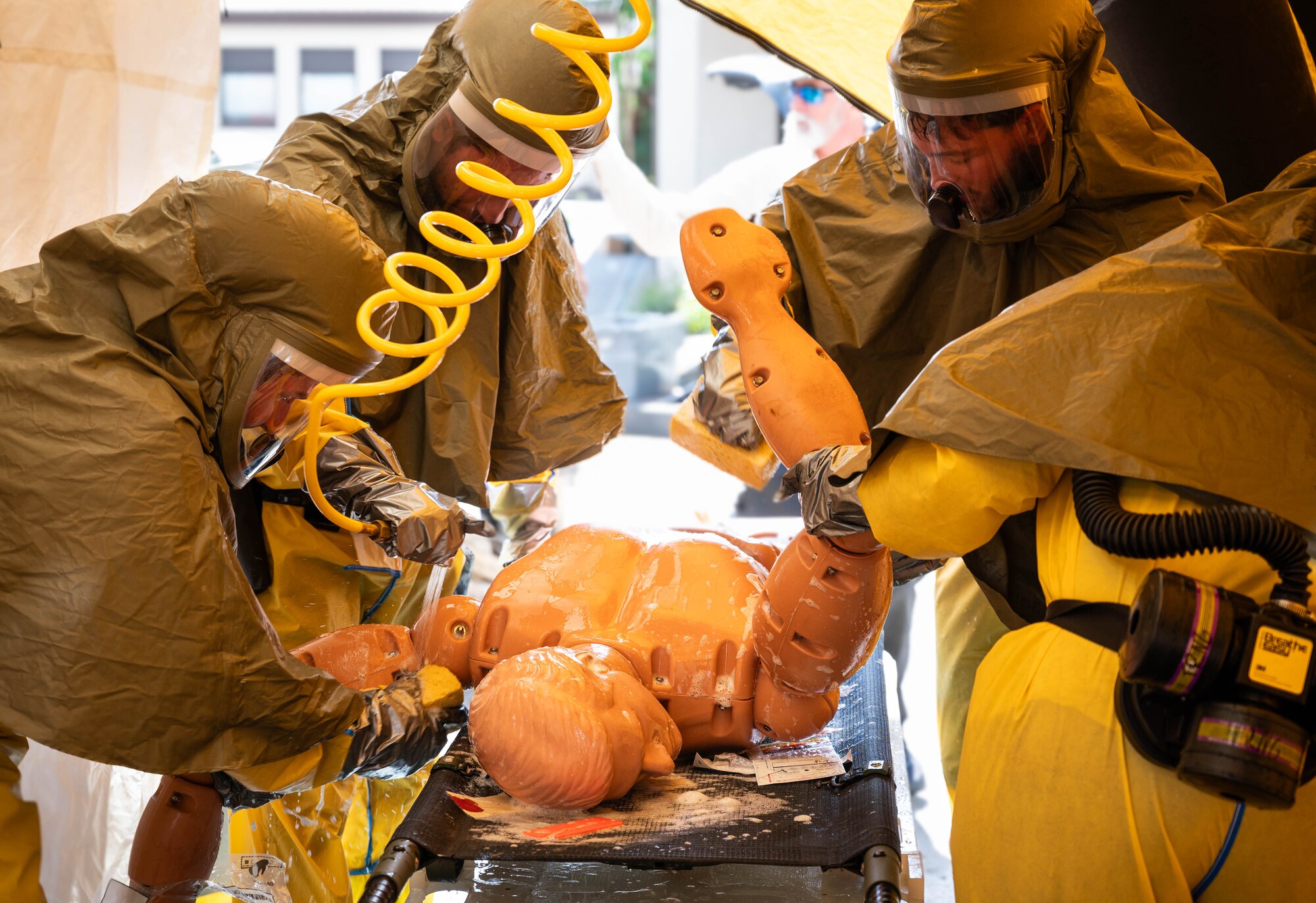 U.S. Air Force Airmen assigned to the 86th Dental Squadron, 86th Health Care Operational Squadron and the 86th Operational Medical Readiness Squadron, perform their in place patient decontamination training capstone at Ramstein Air Base, Germany, Aug. 8, 2024. The objective of the Airmen in the capstone was to save a simulated patient and keep the medical facility operational by keeping the contamination outside. (U.S. Air Force photo by Senior Airman Jared Lovett)
