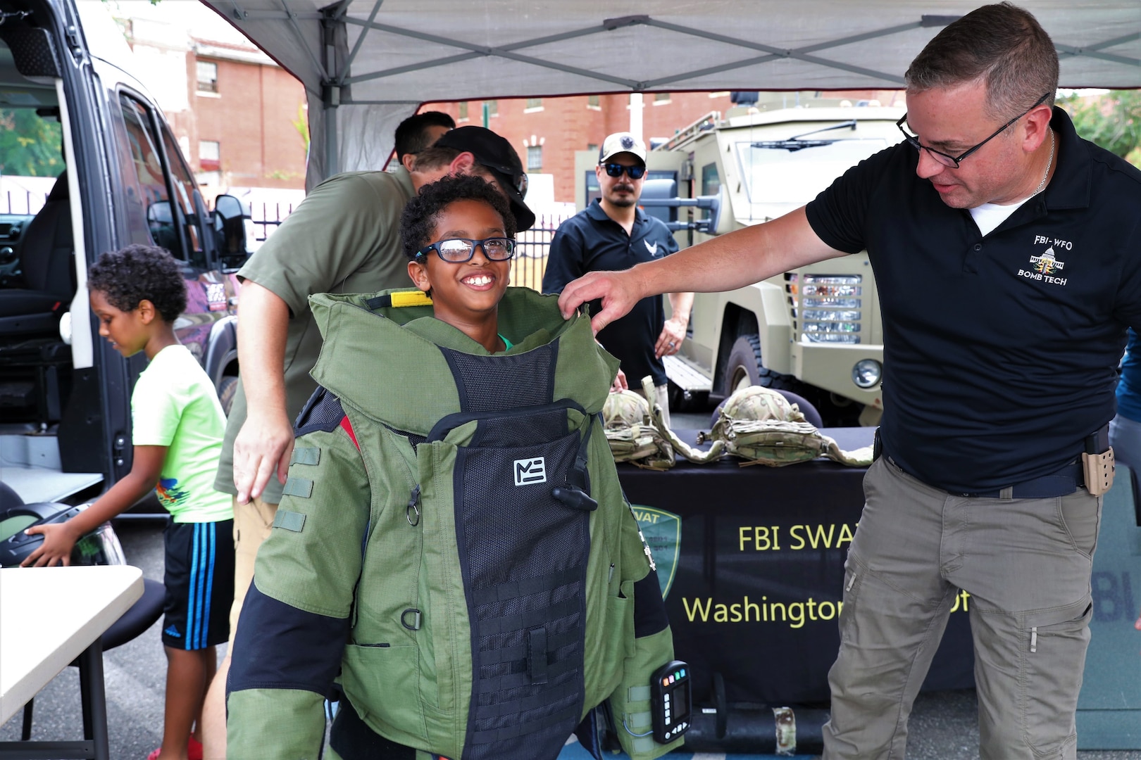 The District of Columbia National Guard Counterdrug Program participated in the Metropolitan Police Department's 41st annual National Night Out celebrations in Southeast Washington, D.C., August 6, 2024. The community-building campaign occurs the first Tuesday of August each year and is held by law enforcement agencies across the country. (U.S. Army National Guard photo by Ayan Sheikh)