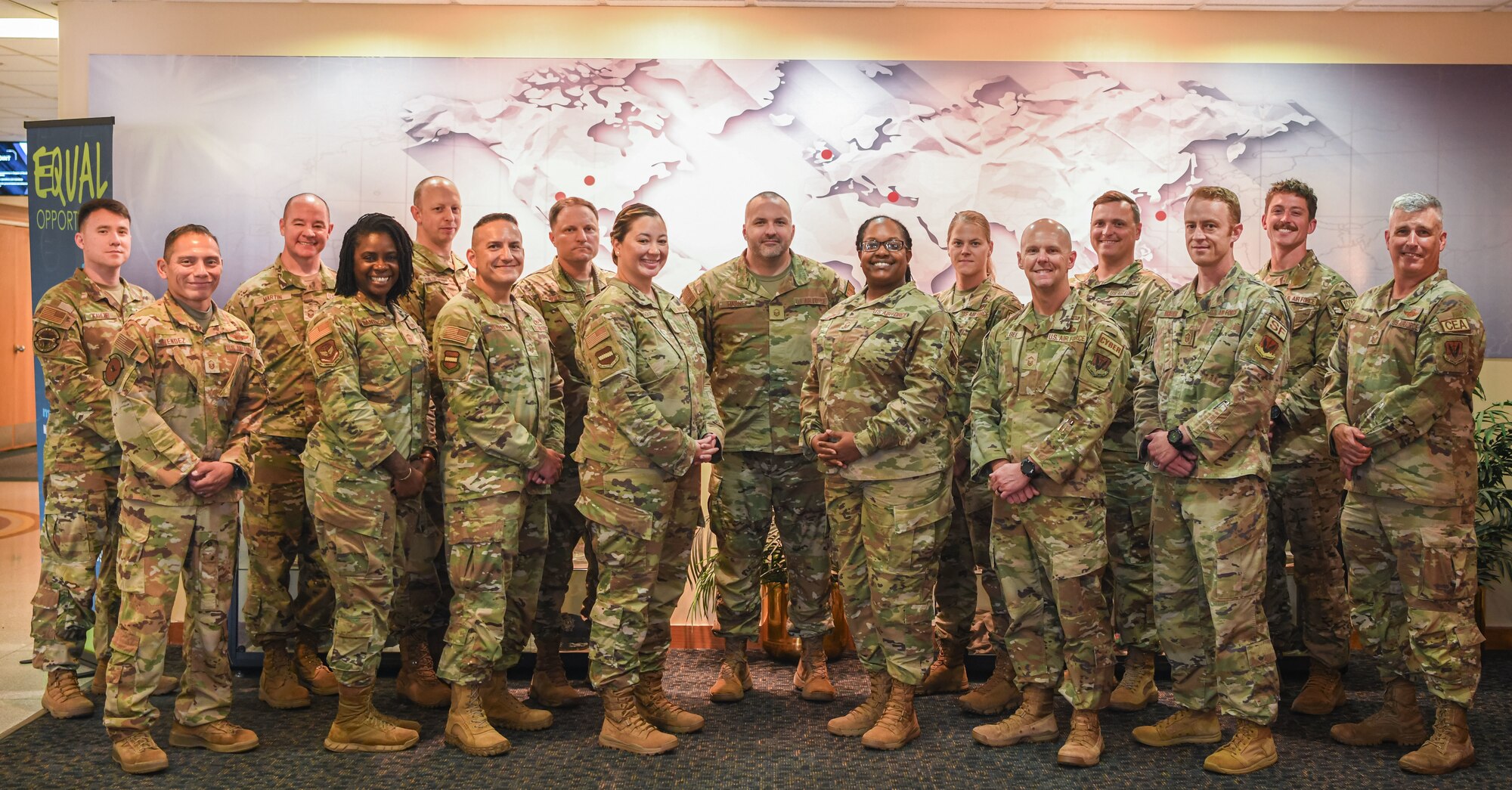 Airmen took a group photo in a lobby
