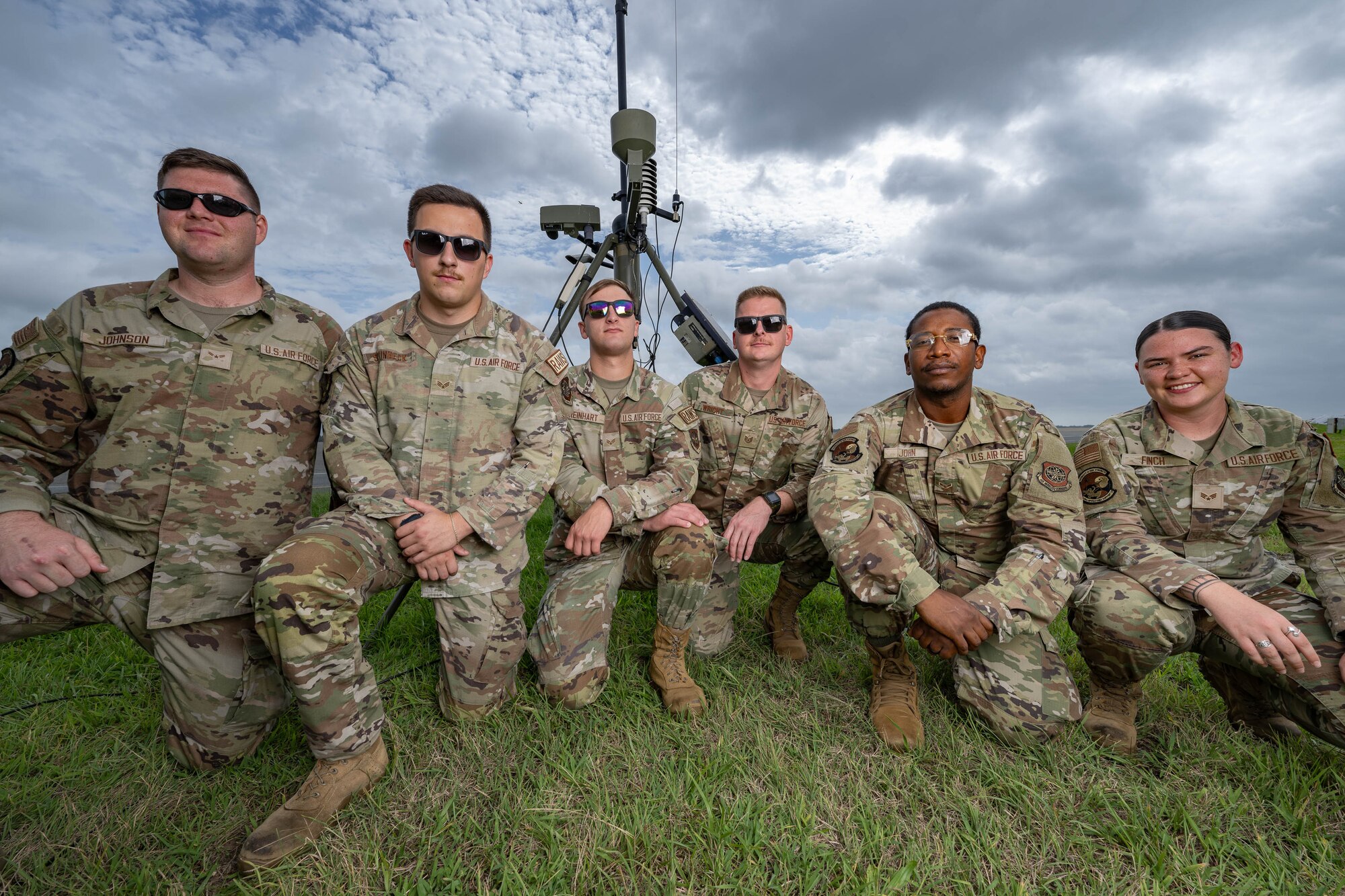 Team Dover Airmen from the 436th Operations Support Squadron radar airfield and weather systems section, pose for a photo in front of a tactical meteorological observing system at Dover Air Force Base, Delaware, Aug. 9, 2024. The section has maintained several units data used in weather forecasting. (U.S. on and around Dover AFB which provide Air Force photo by Mauricio Campino)