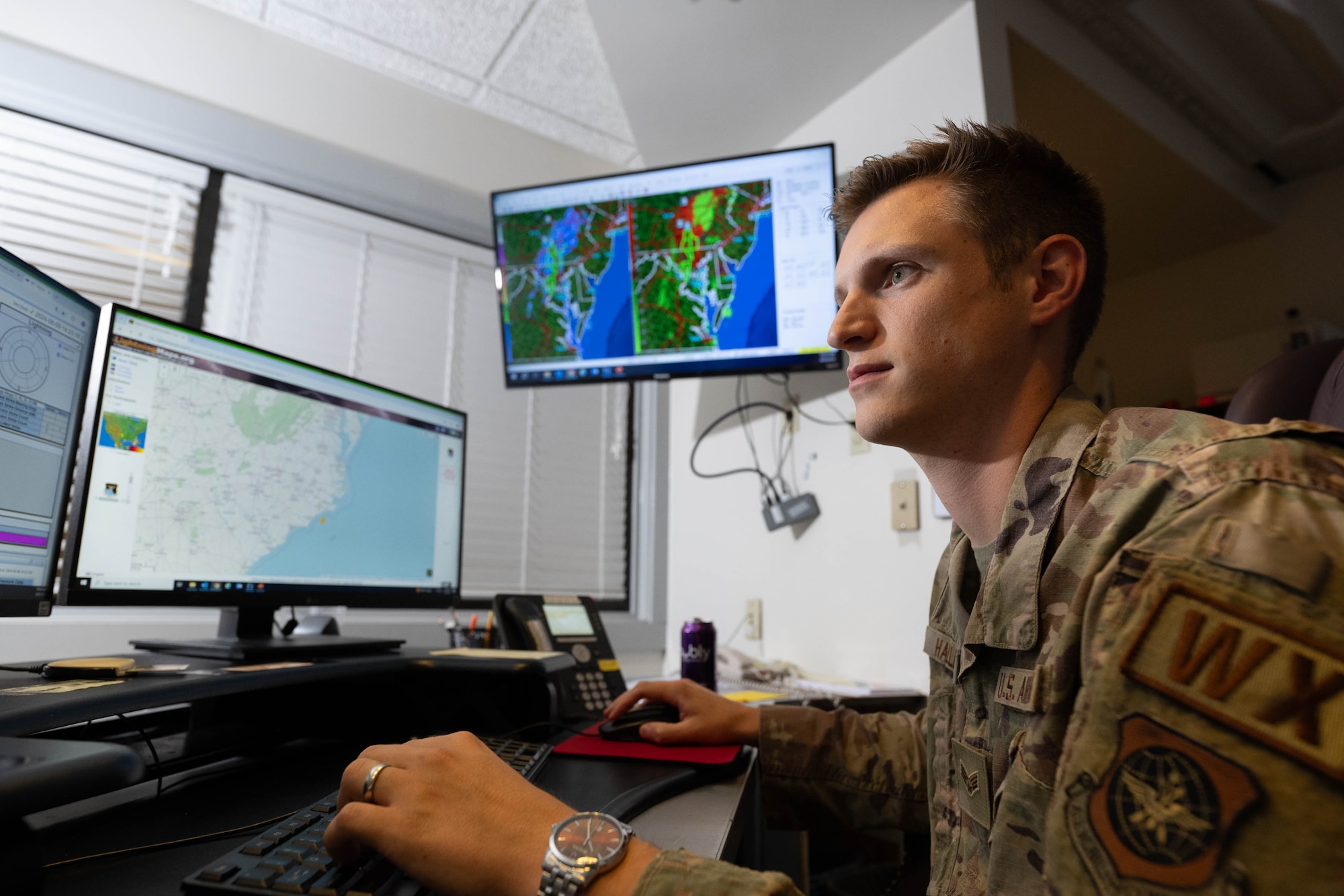 U.S. Air Force Senior Airman Mason Haller, 436th Operations Support Squadron weather forecaster, watches for potential severe storms and tornados at Dover Air Force Base, Delaware, Aug. 9, 2024. Haller used information from multiple weather detection systems around Dover AFB to get the most accurate weather forecast possible. (U.S. Air Force photo by Mauricio Campino)