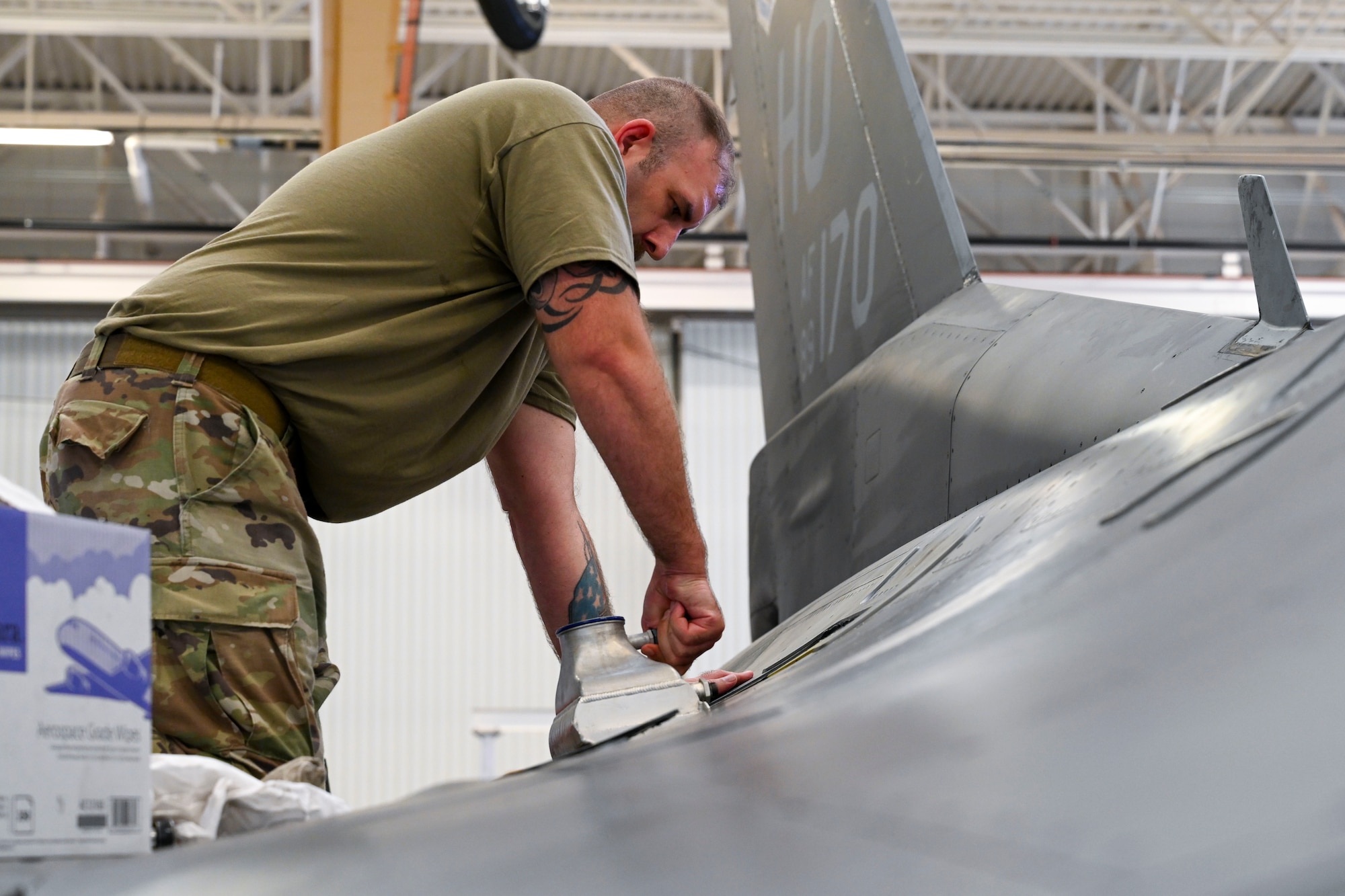 U.S. Air Force Tech. Sgt. Michael Lewis, 373rd Training Squadron aircraft fuels system instructor, performs maintenance on an F-16 Viper at Holloman Air Force Base, New Mexico, Aug. 6, 2024.