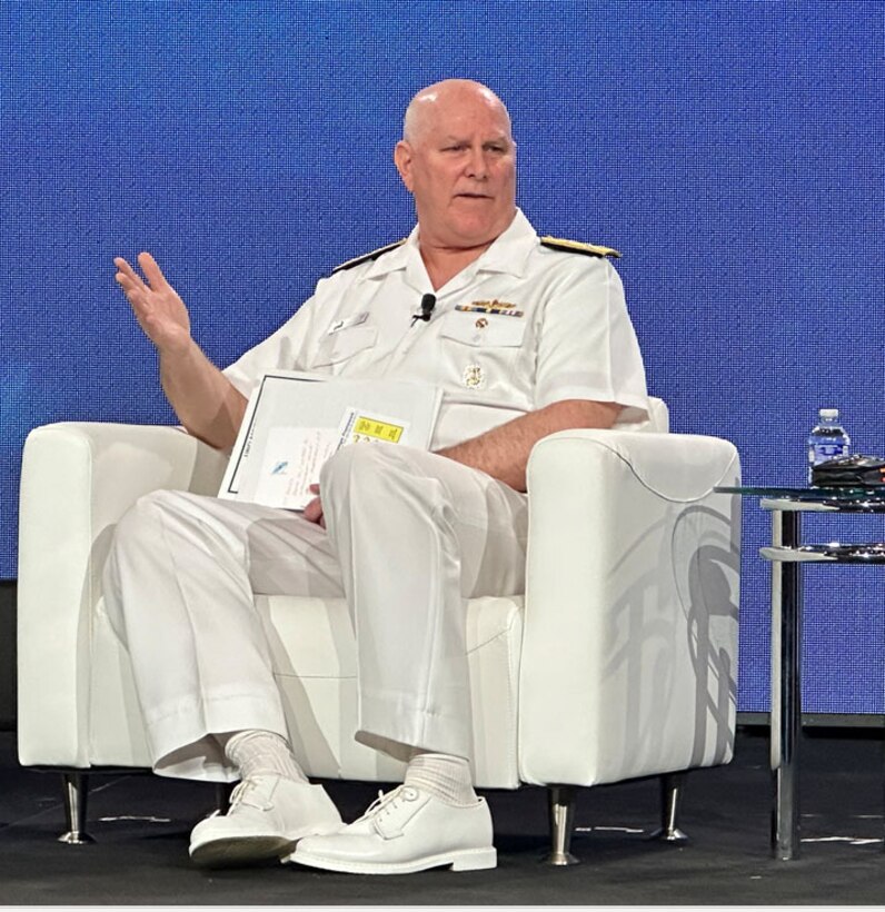 A man speaks to an audience.