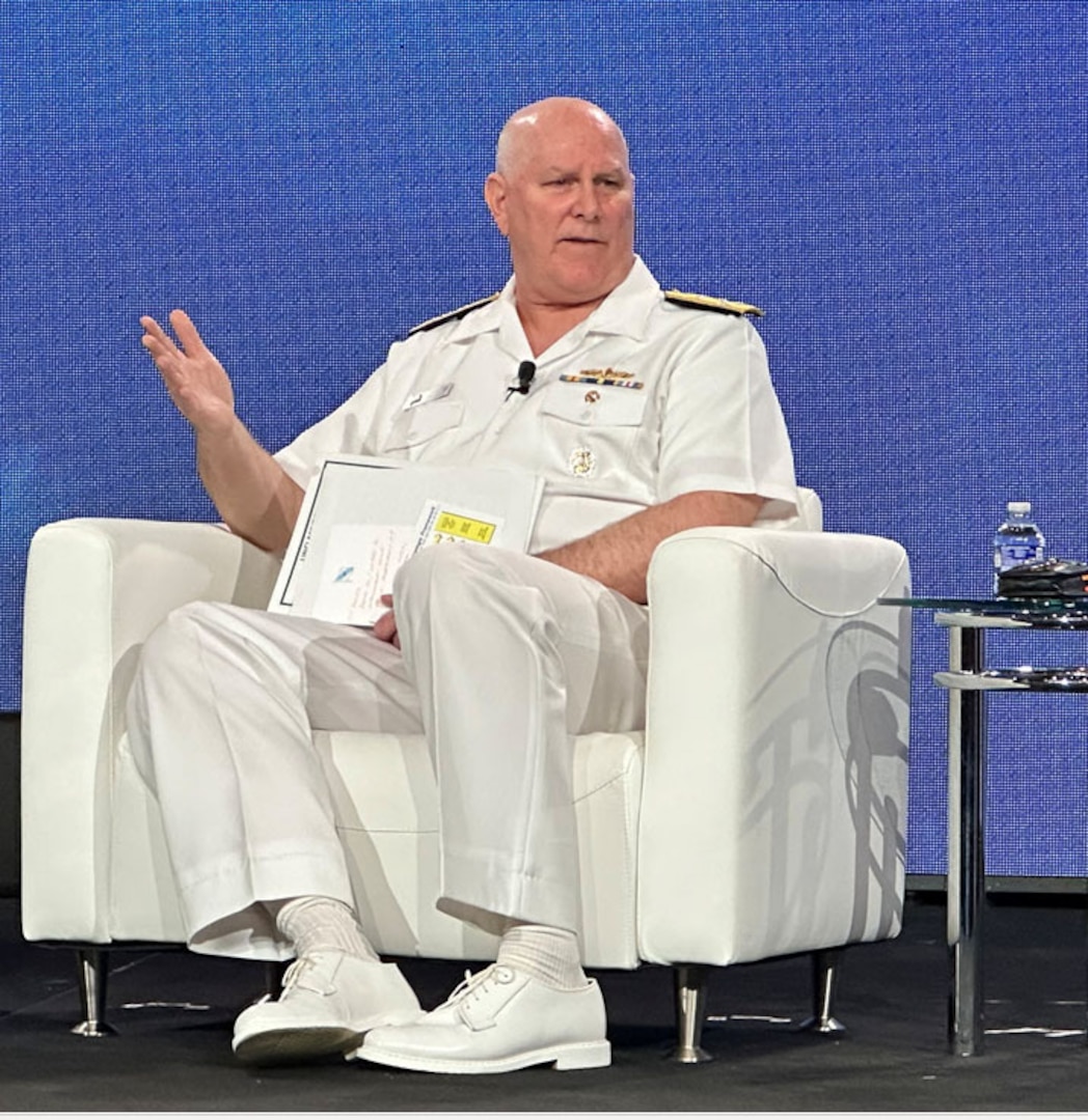 A man speaks to an audience.