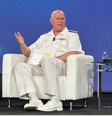 A man speaks to an audience.