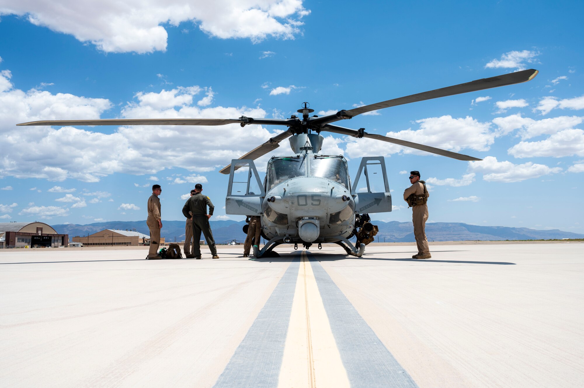 A Bell UH-1Y Venom helicopter from the Marine Light Attack Helicopter Squadron 267 prepares to take off at Holloman Air Force Base, New Mexico, July 16, 2024. The Marines from HMLA-267 and VMM-364 visited the 6th Attack Squadron to explore the integration of their close air support roles with the MQ-9 Reaper’s precision engagement capabilities for future operations. (U.S. Air Force photo by Senior Airman Isaiah Pedrazzini)