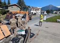 Alaska Army Guardsmen with Joint Task Force – Juneau partner with the Department of Transportation to assist Juneau residents with recovery and cleanup efforts Aug. 8, 2024, following recent flooding after the Mendenhall Glacier’s Suicide Basin released.