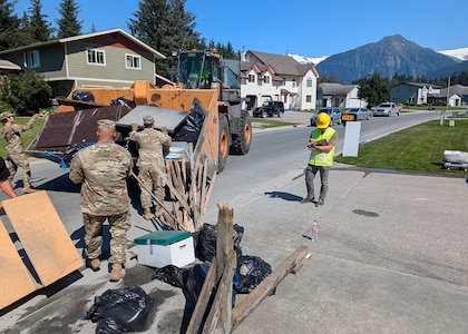 Alaska Army Guardsmen with Joint Task Force – Juneau partner with the Department of Transportation to assist Juneau residents with recovery and cleanup efforts Aug. 8, 2024, following recent flooding after the Mendenhall Glacier’s Suicide Basin released.