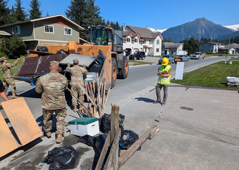 Alaska Army Guardsmen with Joint Task Force – Juneau partner with the Department of Transportation to assist Juneau residents with recovery and cleanup efforts Aug. 8, 2024, following recent flooding after the Mendenhall Glacier’s Suicide Basin released.