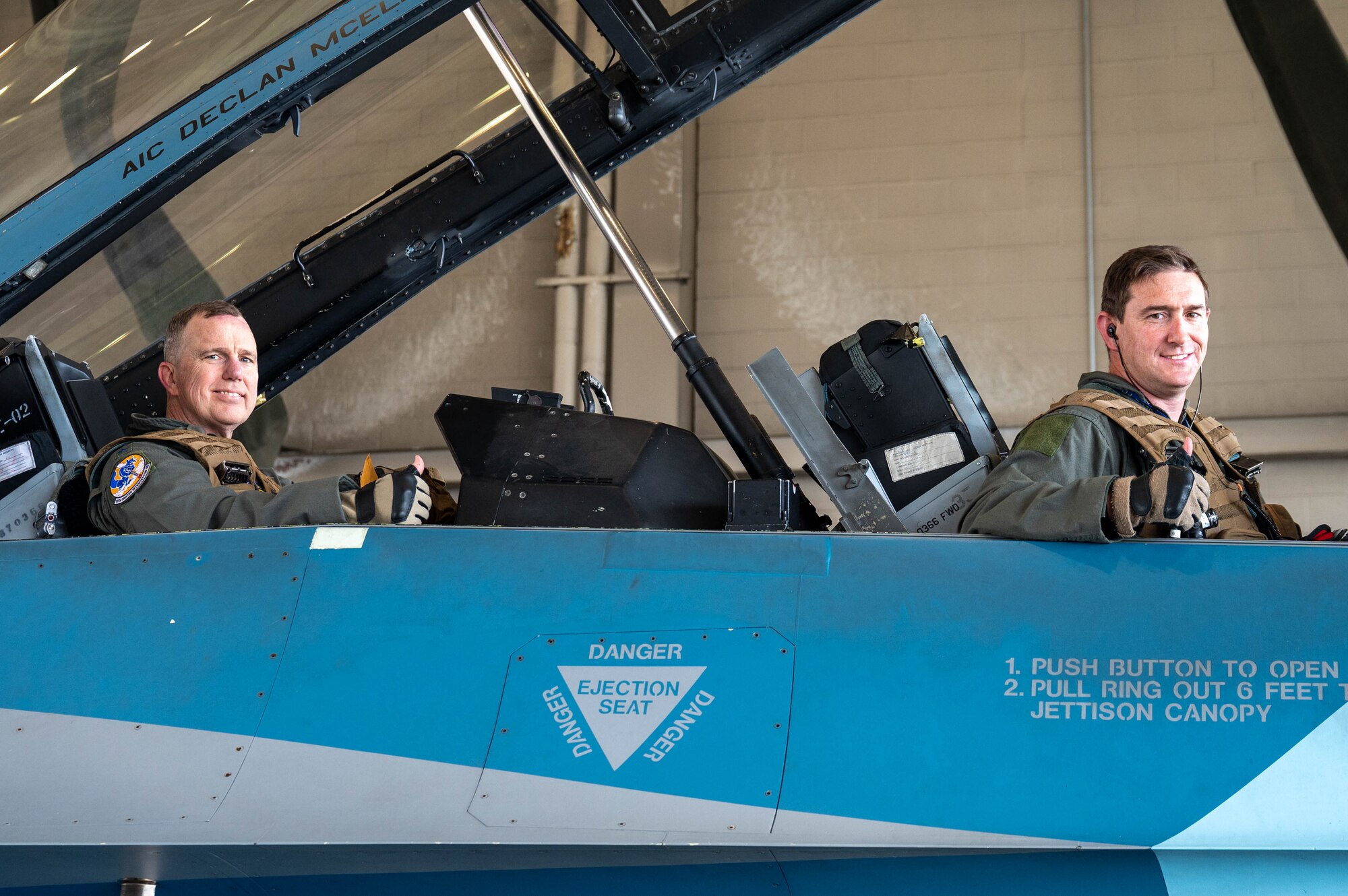 General Gregory Guillot (left), Commander, North American Aerospace Defense Command and U.S. Northern Command, and Maj. Daniel Rule, 18th Fighter Interceptor Squadron F-16 Fighting Falcon pilot, pose for a photo inside in an F-16, at Eielson Air Force Base, Alaska, Aug. 8, 2024.