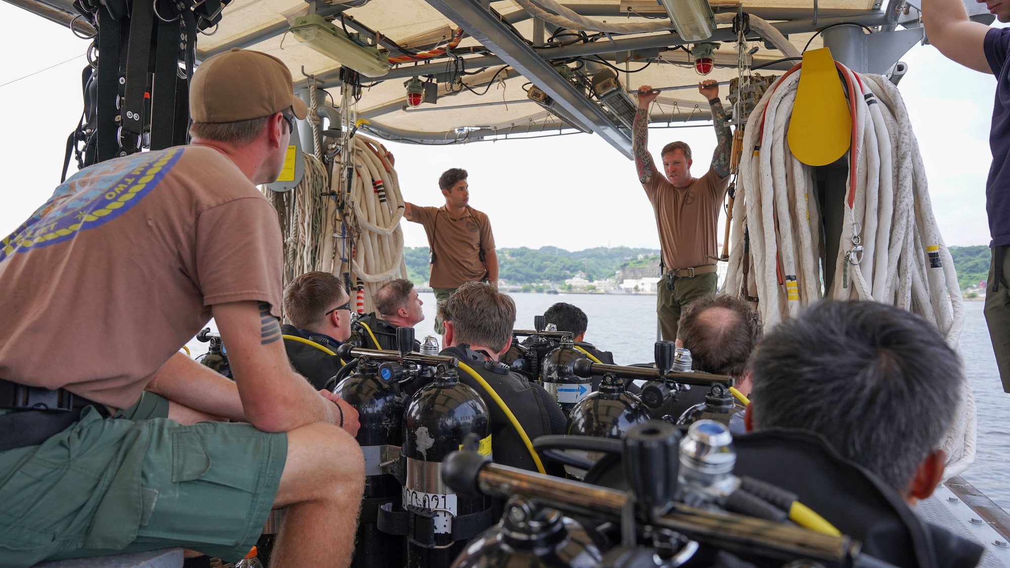 Group of divers on boat hold briefing