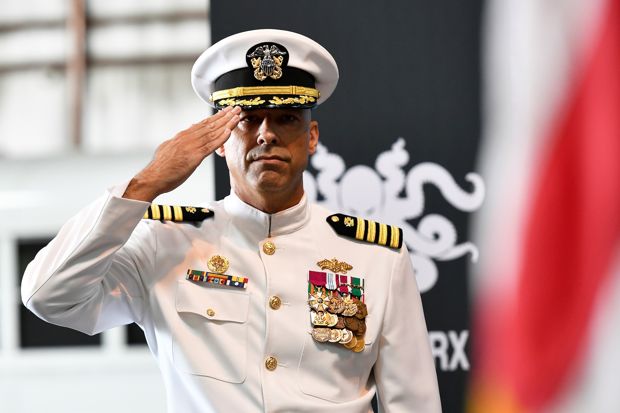 Military Officer in Dress Whites Salutes