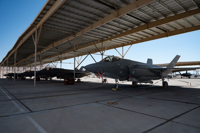 Four F-35s parked on the flightline
