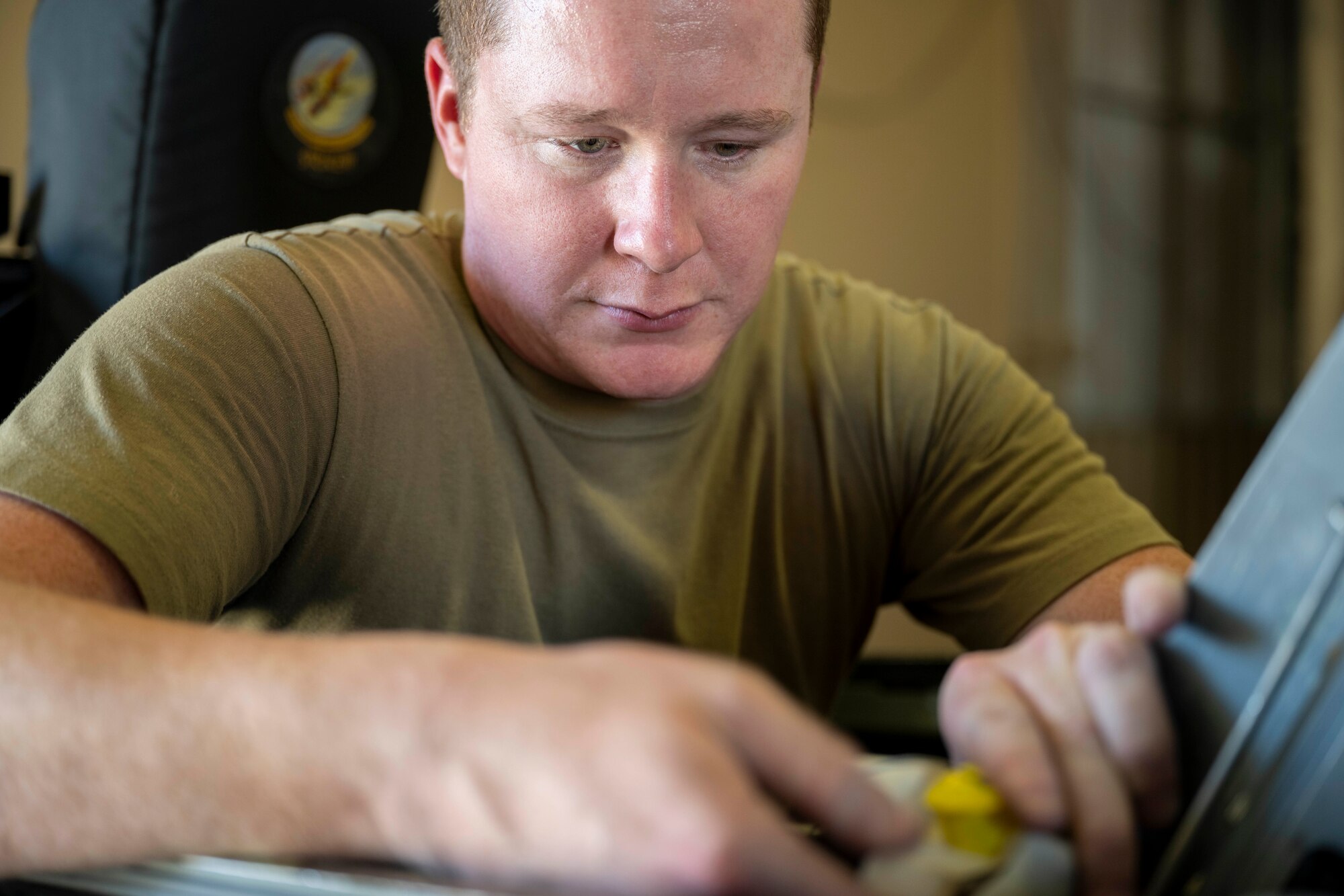 U.S. Air Force Staff Sgt. Joshua Gower, 33rd Maintenance Squadron egress systems technician, performs maintenance on an F-16 Viper seat at Holloman Air Force Base, New Mexico, Aug. 6, 2024.