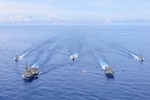 240809-N-VA915-1166 PACIFIC OCEAN (Aug. 9, 2024) Abraham Lincoln Carrier Strike Group and Cavour Carrier Strike Group sail in formation. The United States Navy and the Italian Navy held the first-ever bilateral Multi-Large Deck Event (MLDE) in the Indo-Pacific. Abraham Lincoln, flagship of Carrier Strike Group Three, is underway conducting routine operations in the U.S. 7th Fleet area of operations. U.S. 7th Fleet is the U.S. Navy's largest forward-deployed numbered fleet, and routinely interacts and operates with allies and partners in preserving a free and open Indo-Pacific region. (U.S. Navy photo by Mass Communication Specialist 1st Class Jerome D. Johnson)