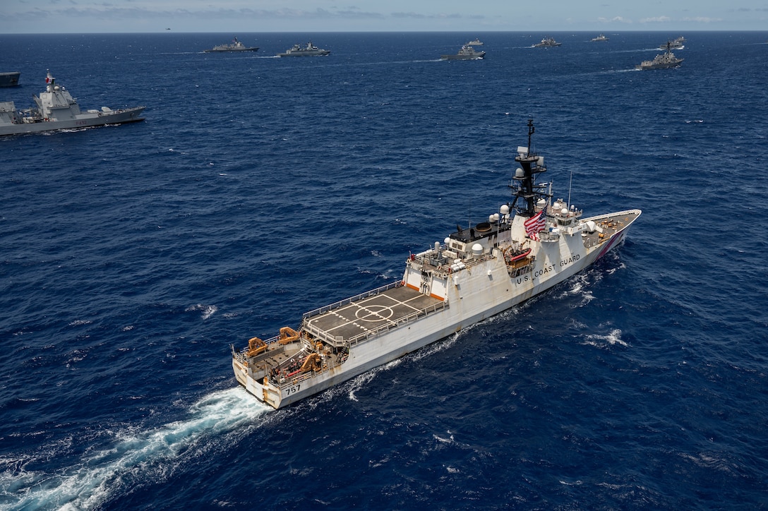 U.S. Coast Guard Legend-class cutter USCGC Midget (WMSL 757) sails in formation July 22, off the coast of Hawaii during Exercise Rim of the Pacific (RIMPAC) 2024. Twenty-nine nations, 40 surface ships, three submarines, 14 national land forces, more than 150 aircraft and 25,000 personnel are participating in RIMPAC in and around the Hawaiian Islands, June 27 to Aug. 1. The world's largest international maritime exercise, RIMPAC provides a unique training opportunity while fostering and sustaining cooperative relationships among participants critical to ensuring the safety of sea lanes and security on the world's oceans. RIMPAC 2024 is the 29th exercise in the series that began in 1971. (U.S. Navy photo by Mass Communication Specialist 1st Class John Bellino)