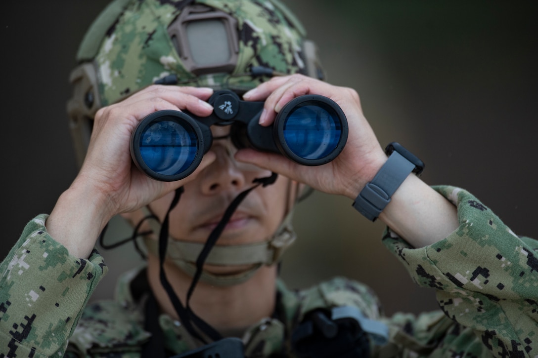 Coast Guardsmen from Port Security Unit 311, Shoreside Security Division perform as simulated enemy combatants during a mine clearing exercise at Bellows Air Force Station, Hawaii 24 during Exercise Rim of the Pacific (RIMPAC) July 24, 2024. 

Twenty-nine nations, 40 surface ships, three submarines, 14 national land forces, more than 150 aircraft and 25,000 personnel are participating in Rim of the Pacific Exercise (RIMPAC) in and around the Hawaiian Islands, June 27 to Aug. 1. 

The world’s largest international maritime exercise, RIMPAC provides a unique training opportunity while fostering and sustaining cooperative relationships among participants critical to ensuring the safety of sea lanes and security on the world’s oceans RIMPAC 2024 is the 29th exercise in the series that began in 1971.