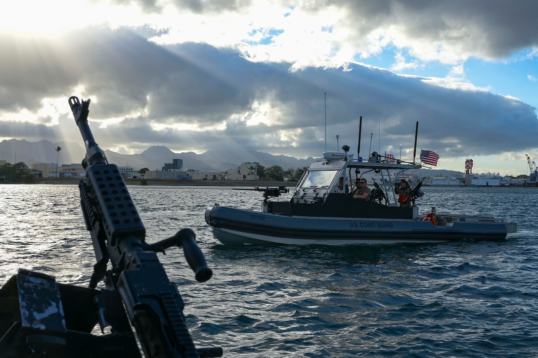 Crewmembers from U.S. Coast Guard Port Security Unit 311 practice security escort of the decommissioned amphibious assault ship, USS Tarawa, as it is towed out to sea for a tactical exercise during RIMPAC 2024. Twenty-nine nations, 40 surface ships, three submarines, 14 national land forces, more than 150 aircraft and 25,000 personnel are participating in RIMPAC in and around the Hawiian Islands, June 27 to Aug 1. The worlds largest international maritime exercise, RIMPAC provides a unique training opportunity while fostering and sustaining cooperative relationships among participants critical to ensuring the safety of sea lanes and security on the worlds oceans. RIMPAC 2024 is the 29th exercise in the series that began in 1971.

(U.S. Air Force photo by Staff Sgt. Jerreht Harris)