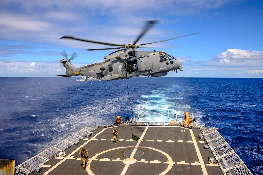 Legend-class cutter USCGC Midgett (WMSL 757) hosts a multi-ship interdiction and boarding exercise with Italian Navy offshore patrol vessel ITS Montecuccoli (P 432), who fast-roped a boarding team of seven onto Midgett simulating an at-sea boarding of a suspected arms smuggling vessel during Exercise Rim of the Pacific (RIMPAC 2024), July 15, while underway in the Pacific Ocean. Twenty-nine nations, 40 surface ships, three submarines, 14 national land forces, more than 150 aircraft, and 25,000 personnel are participating in and around the Hawaiian Islands, June 27 to Aug. 1. The world’s largest international maritime exercise; RIMPAC provides a unique training opportunity while fostering and sustaining cooperative relationships among participants critical to ensuring the safety of sea lanes and security on the world’s oceans. RIMPAC 2024 is the 29th exercise in the series that began in 1971.  (U.S. Coast Guard photo by David Lau)