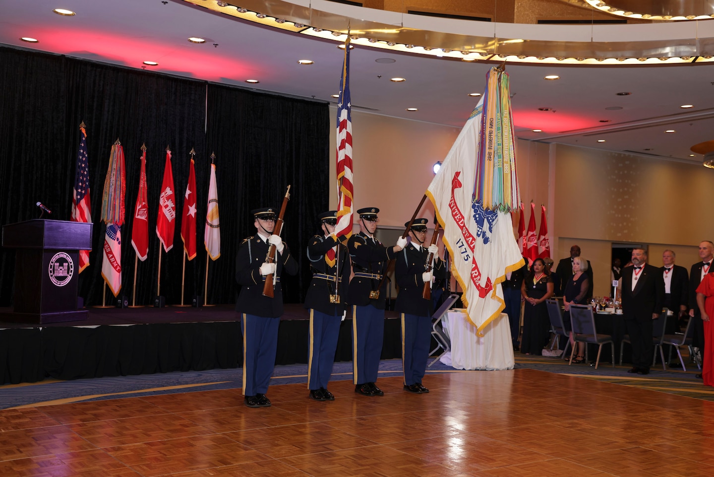 The Army color guard is in dress blues presenting the colors.