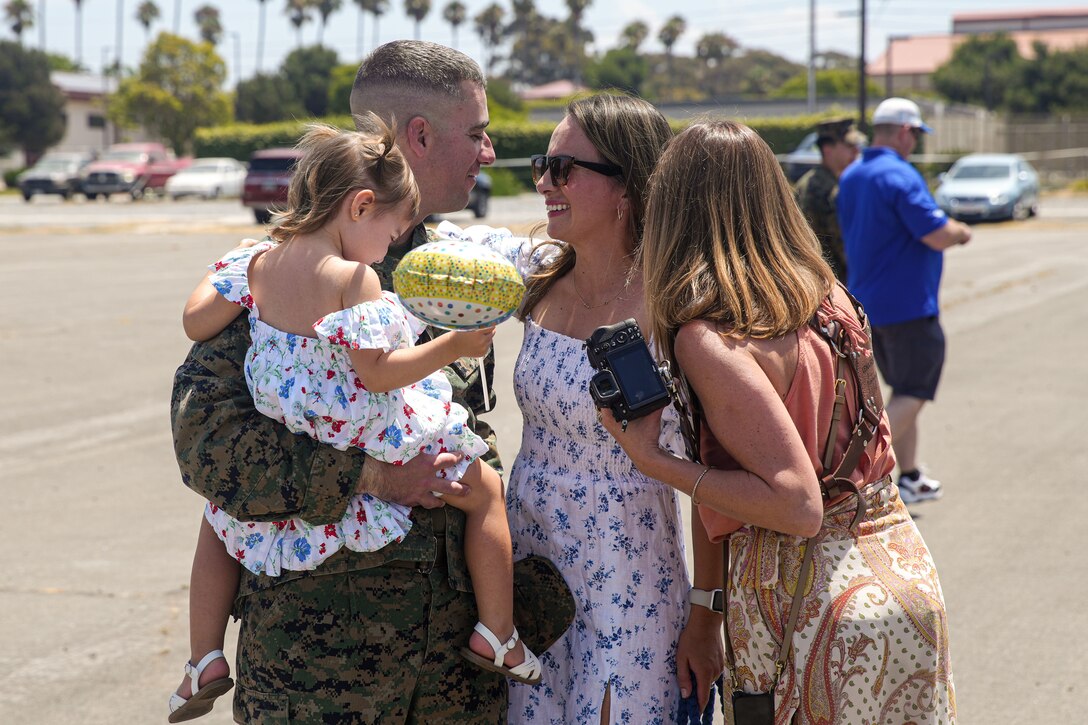 U.S. Marine Corps Maj. Peter Bose, the future operations officer assigned to the 15th Marine Expeditionary Unit, reunites with his family at a welcome home reception at Marine Corps Base Camp Pendleton, California Aug. 10, 2024. Elements of the 15th MEU, embarked aboard amphibious transport dock USS Somerset (LPD 25), returned to Marine Corps Base Camp Pendleton after a seven-month deployment to the Indo-Pacific region in support of regional stability and a free and open Indo-Pacific. (U.S. Marine Corps photo by 1st Lt. Robert Nanna)