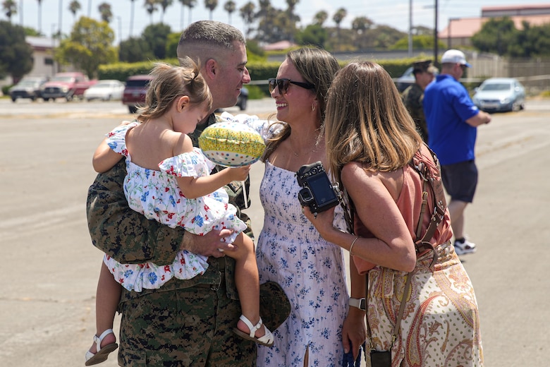 U.S. Marine Corps Maj. Peter Bose, the future operations officer assigned to the 15th Marine Expeditionary Unit, reunites with his family at a welcome home reception at Marine Corps Base Camp Pendleton, California Aug. 10, 2024.