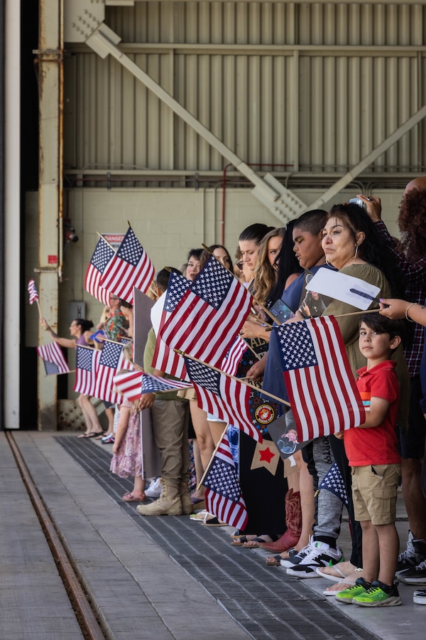 Friends and family await the arrival of U.S. Marines with Marine Medium Tiltrotor Squadron (VMM) 165 (Reinforced), 15th Marine Expeditionary Unit, during a homecoming at Marine Corps Air Station Miramar, California, Aug. 9, 2024. Elements of the 15th MEU, embarked aboard the amphibious transport dock ship USS Somerset (LPD 25), returned home after a seven-month deployment to the Indo-Pacific region in support of regional stability and a free and open Indo-Pacific. (U.S. Marine Corps photo by Lance Cpl. Alexis Ibarra)