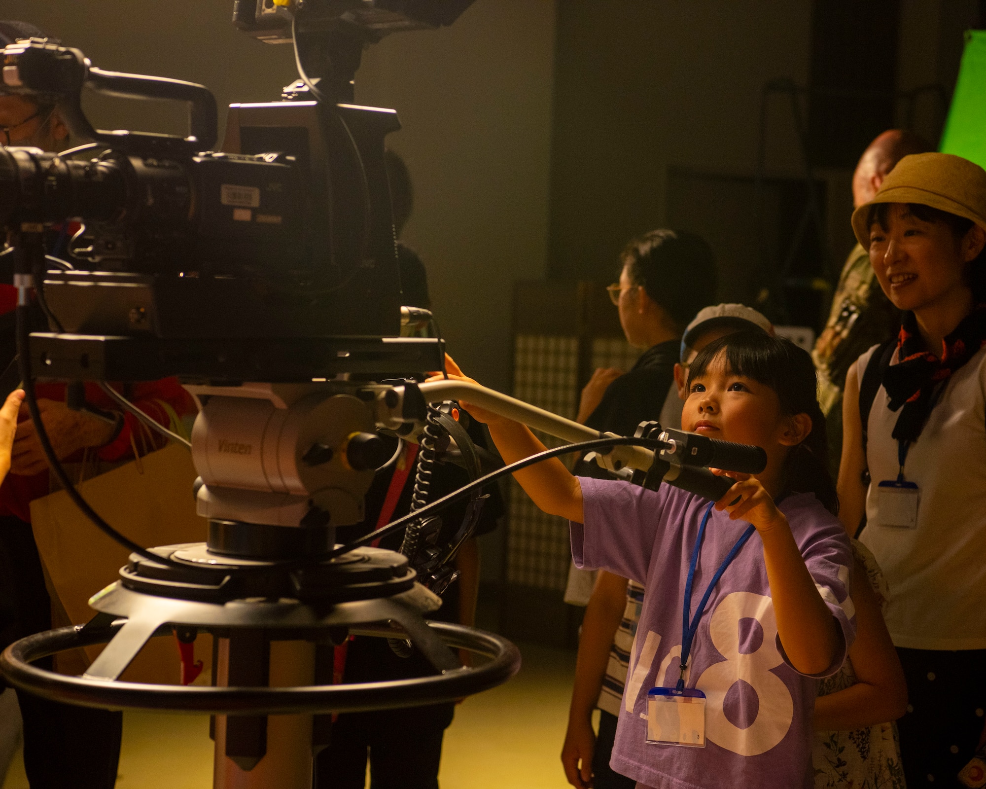 A Misawa Friendship Tour participant learns about a television camera at Misawa Air Base, Japan, Aug. 2, 2024.