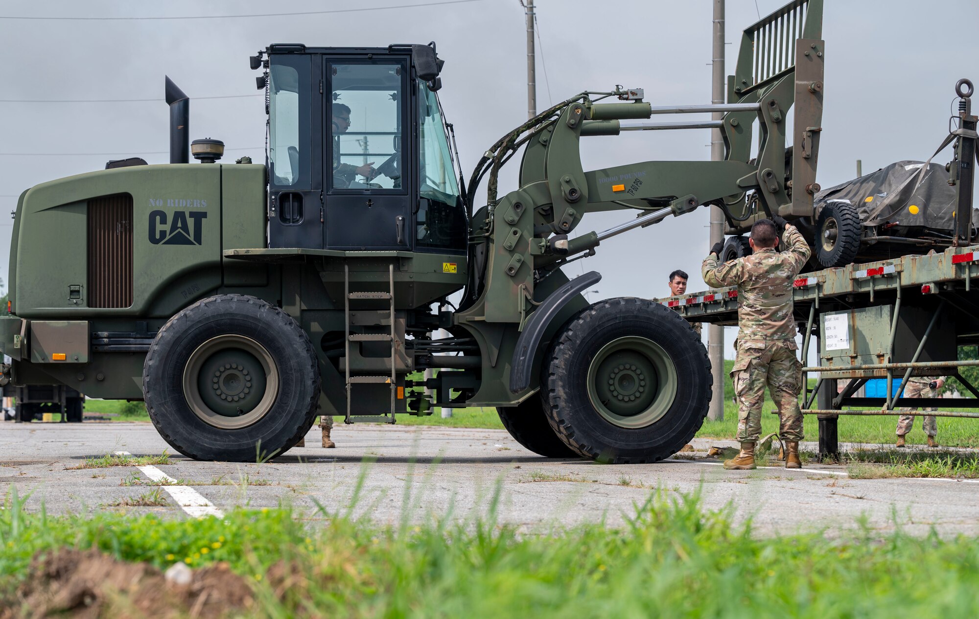 U.S. Air Force Airmen assigned to the 51st Logistics Readiness Squadron load cargo during a training event at Osan Air Base, Republic of Korea, Aug. 8, 2024. The 51st LRS performs cargo functions such as transportation of supplies and logistics to ensure the 51st Fighter Wing remains mobile and sustained with necessary resources. (U.S. Air Force photo by Senior Airman Sabrina Fuller-Judd)