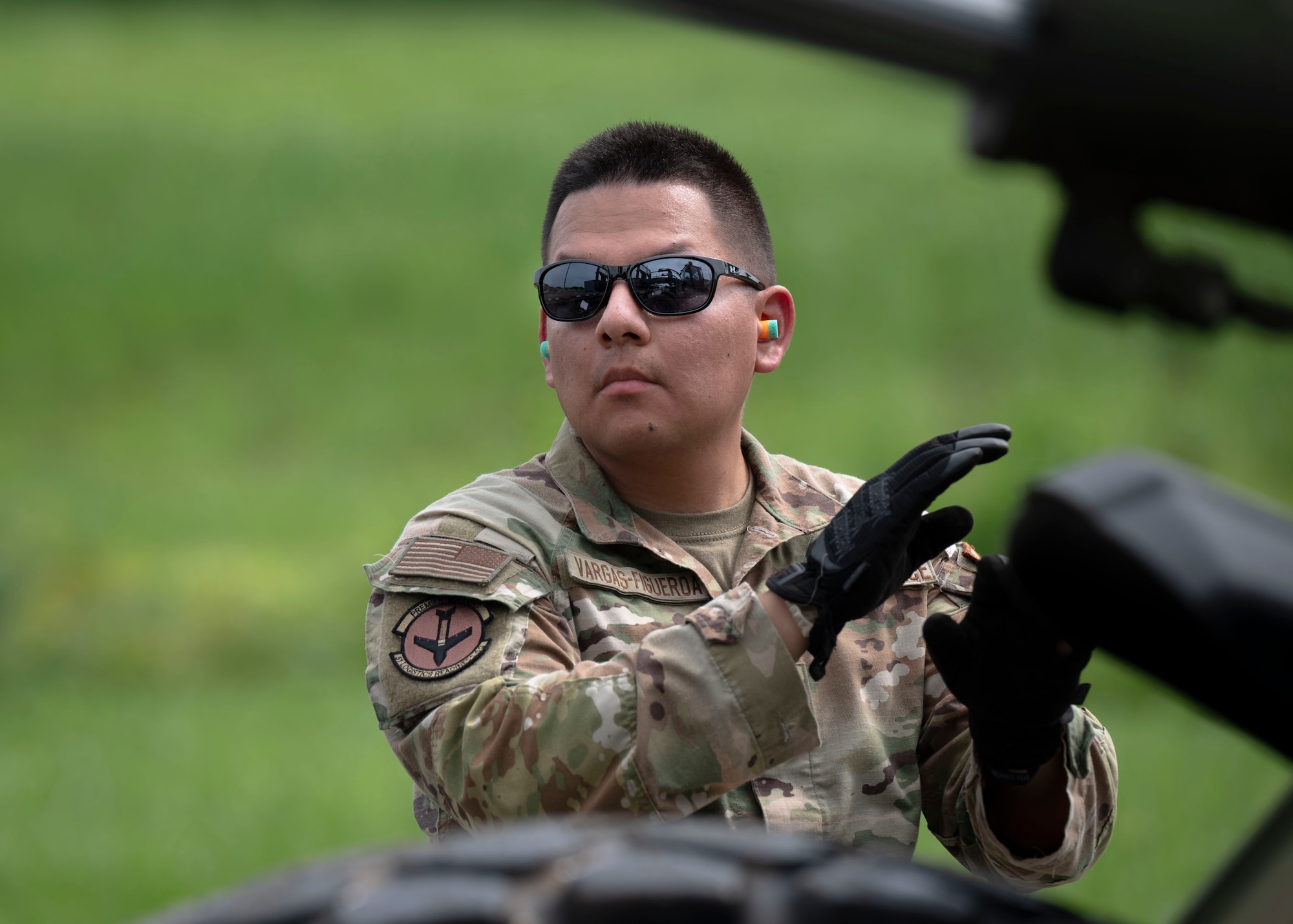 U.S. Air Force Senior Airman David Vargos Figueroa, 51st Logistics Readiness Squadron ground transportation journeyman, directs a forklift operator during a training event at Osan Air Base, Republic of Korea, Aug 8, 2024. The 51st LRS operated a forklift to transfer various cargo with the 51st Munitions Squadron to expand the multifunctional abilities needed to carry out the “Fight Tonight” mission. (U.S. Air Force photo by Senior Airman Sabrina Fuller-Judd)