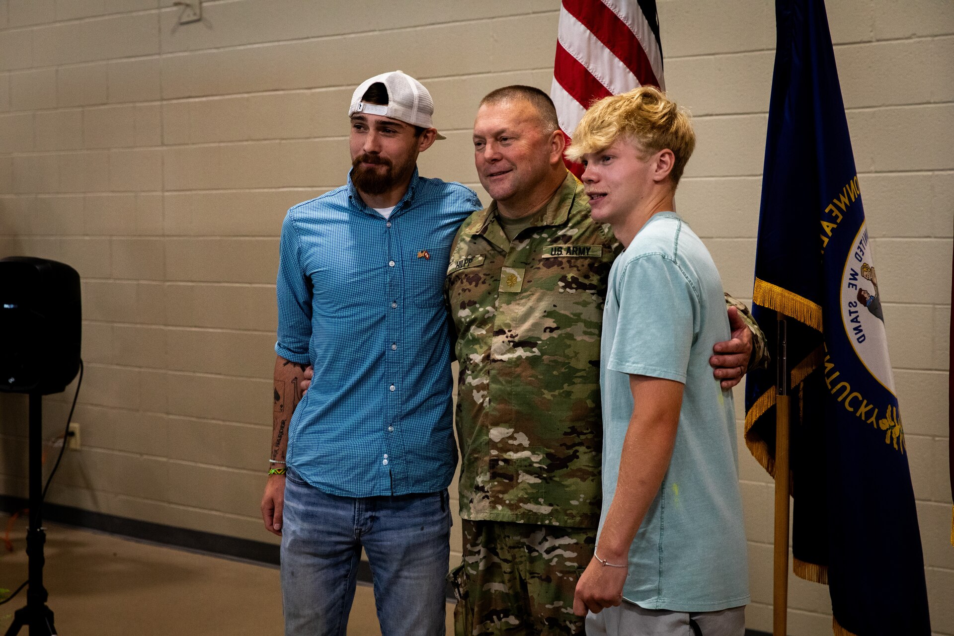 U.S. Army Maj. Charles Hilpp, an engineer officer with the  613th Engineer Facilities Detachment, 149th Maneuver Enhancement Brigade, pose for photos with his family and friends at the Springfield Army National Guard Armory in Springfield, Kentucky on August 5, 2024. Approximately 15 Soldiers of the 613 FACDET are departing for Kuwait for base directorate of public works mission at Camp Buehring. (U.S. Army National Guard photo by Andy Dickson)