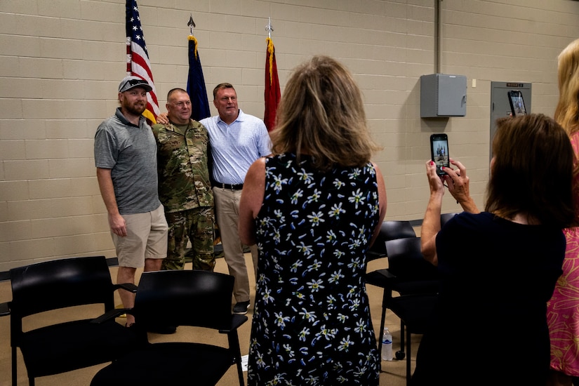 U.S. Army Maj. Charles Hilpp, an engineer officer with the  613th Engineer Facilities Detachment, 149th Maneuver Enhancement Brigade, pose for photos with his family and friends at the Springfield Army National Guard Armory in Springfield, Kentucky on August 5, 2024. Approximately 15 Soldiers of the 613 FACDET are departing for Kuwait for base directorate of public works mission at Camp Buehring. (U.S. Army National Guard photo by Andy Dickson)