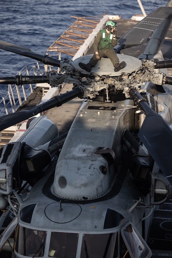 A U.S. Marine with Marine Medium Tiltrotor Squadron 365 (Reinforced), 24th Marine Expeditionary Unit (MEU) Special Operations Capable (SOC), prepares to stow the rotors of a CH-53E Super Stallion aboard the San Antonio-class amphibious transport dock ship USS New York (LPD 21) while underway in the Mediterranean Sea, August 3, 2024. The Wasp (WSP) Amphibious Ready Group and embarked 24th MEU (SOC) is conducting operations in the U.S. Naval Forces Europe and Africa area of operations on a scheduled deployment. The WSP ARG-24th MEU (SOC) is supporting U.S., Allied and partner interests in the region, including in the Eastern Mediterranean Sea, to continue promoting regional stability and deterring aggression. (U.S. Marine Corps photo by Cpl. Ryan Ramsammy)