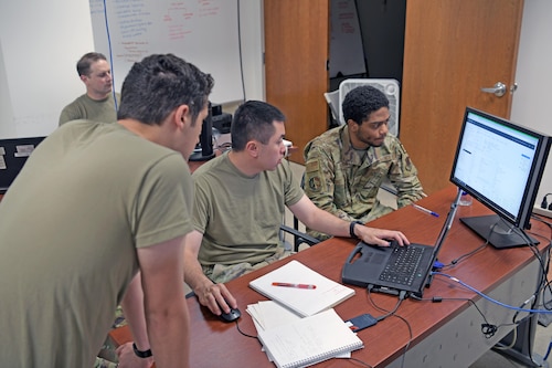 Airmen working at computer