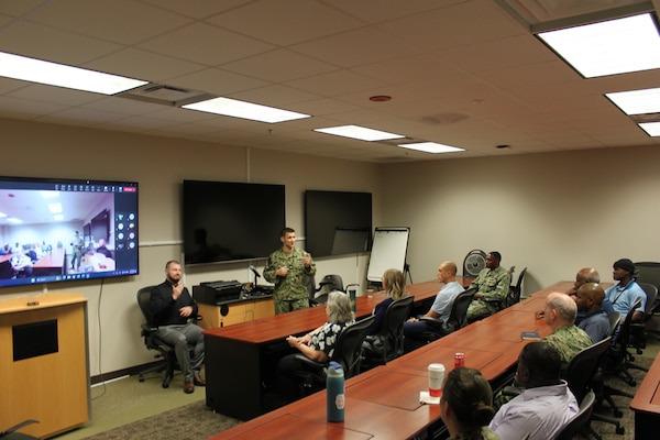 Capt. Christopher Barnes, commanding officer, Naval Medical Readiness Logistics Command addresses NMRLC Detachment Fort Detrick personnel before celebrating the MSC 77th birthday.