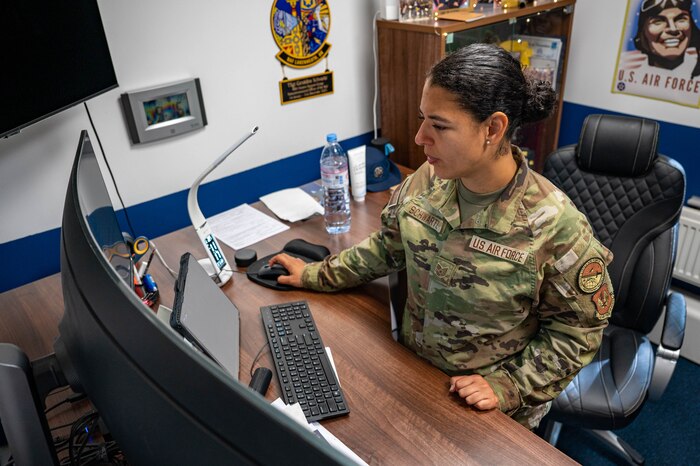 TSgt sits at desk